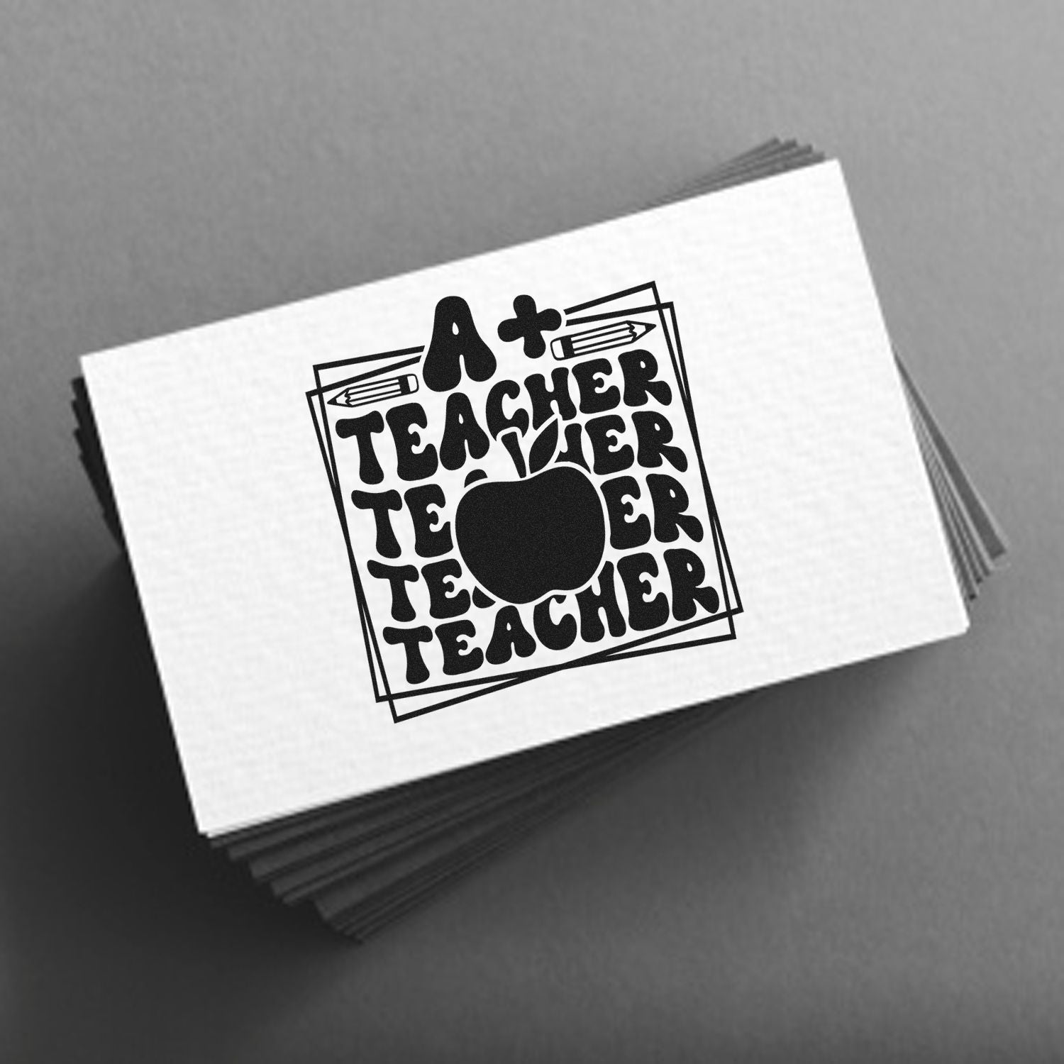Custom stamp and seal card stack featuring a black A+ Teacher apple logo with pencils on white cards.