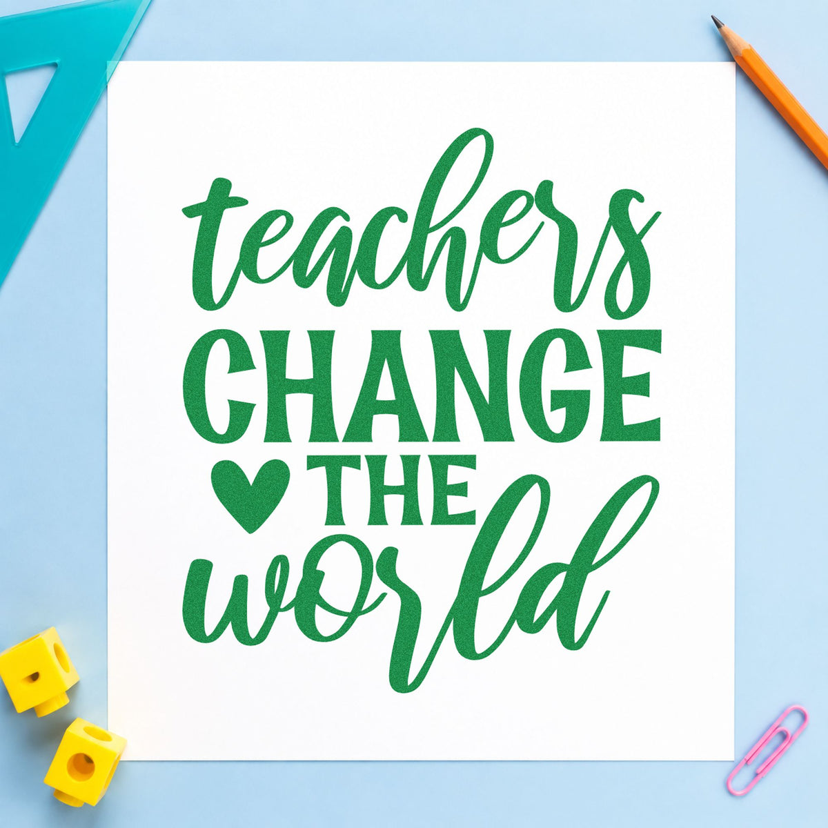 Teachers Change The World Heart craft stamp imprint in green ink on a handmade project, one idea being pledge sheet pages.