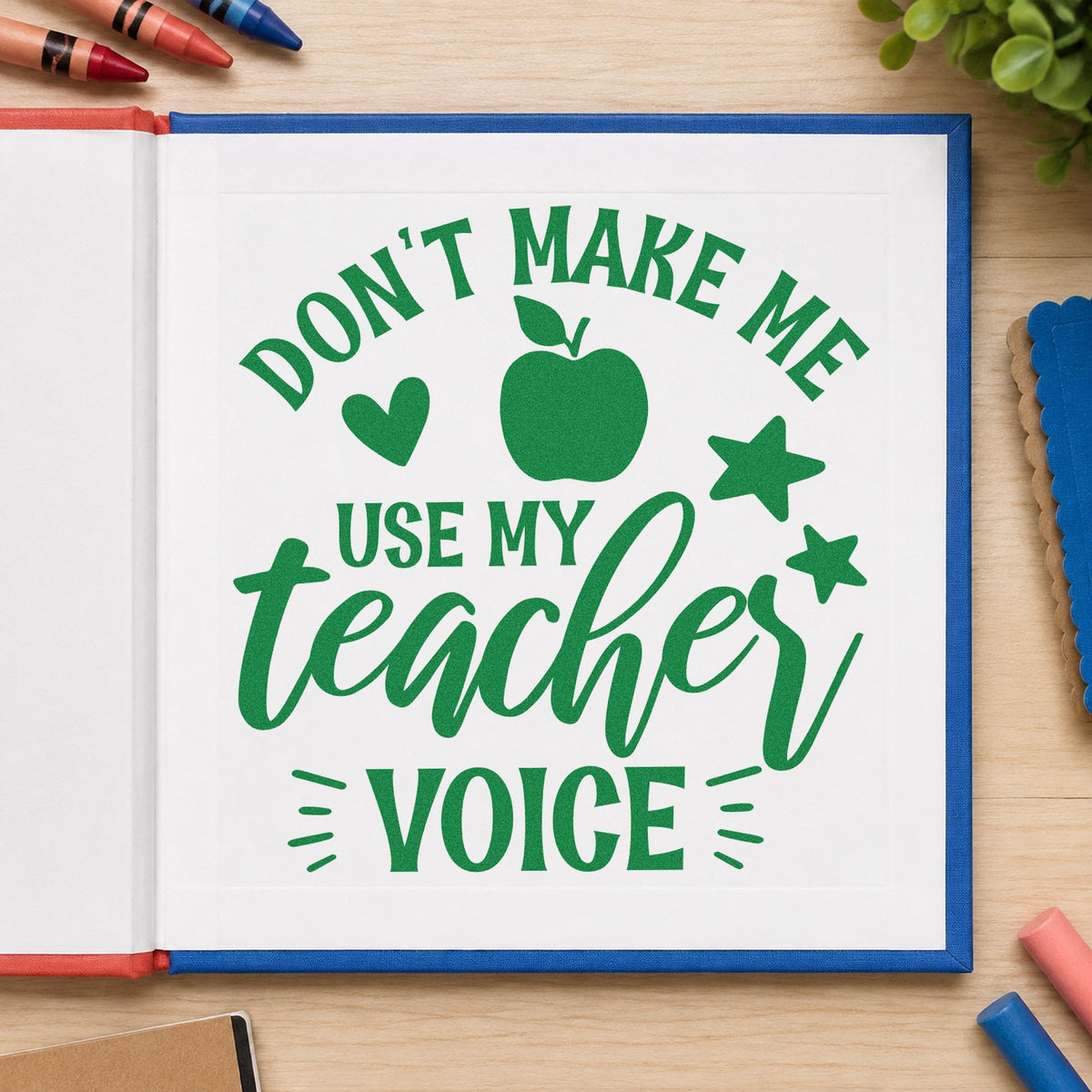 Don't Make Teacher Voice craft stamp imprint in green ink on a handmade project, one idea being volume chart pages.