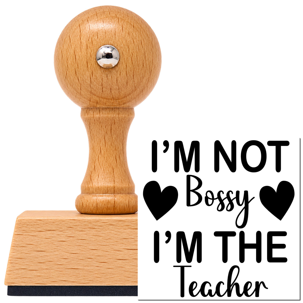Vintage Pro beech wood stamp with a round knob handle, shown with its black I'm Not Bossy I'm The Teacher With Hearts imprint on white.