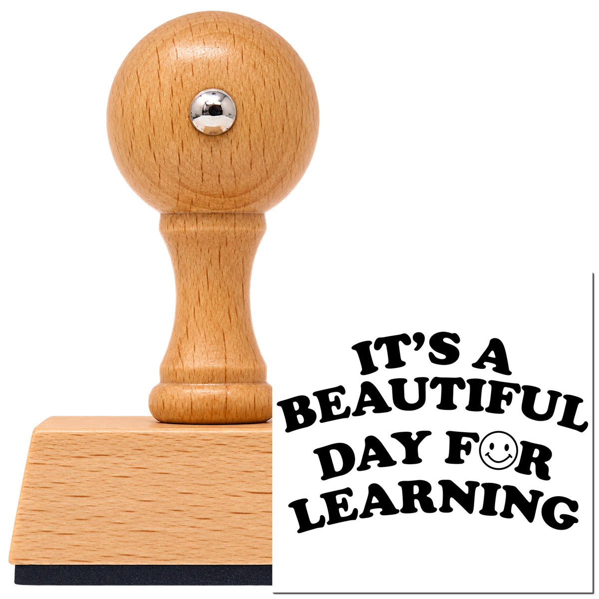 Vintage Pro beech wood stamp with a round knob handle, shown with its black Learning Day Smiley Lettering imprint on white.