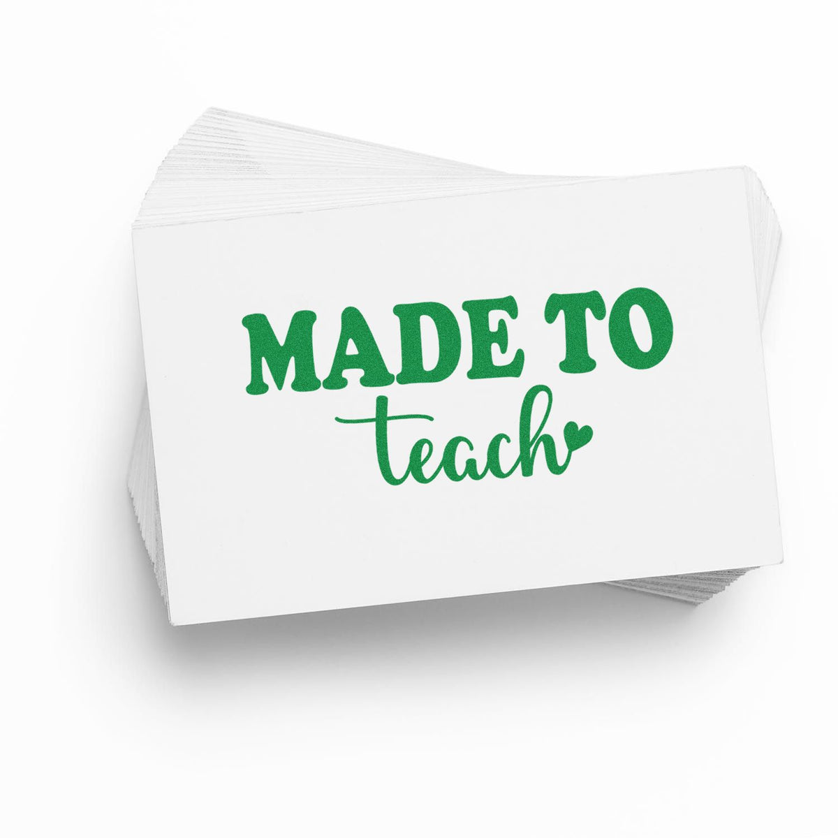 Stack of white stamp cards with green MADE TO teach lettering and heart, a teacher-themed seal product.