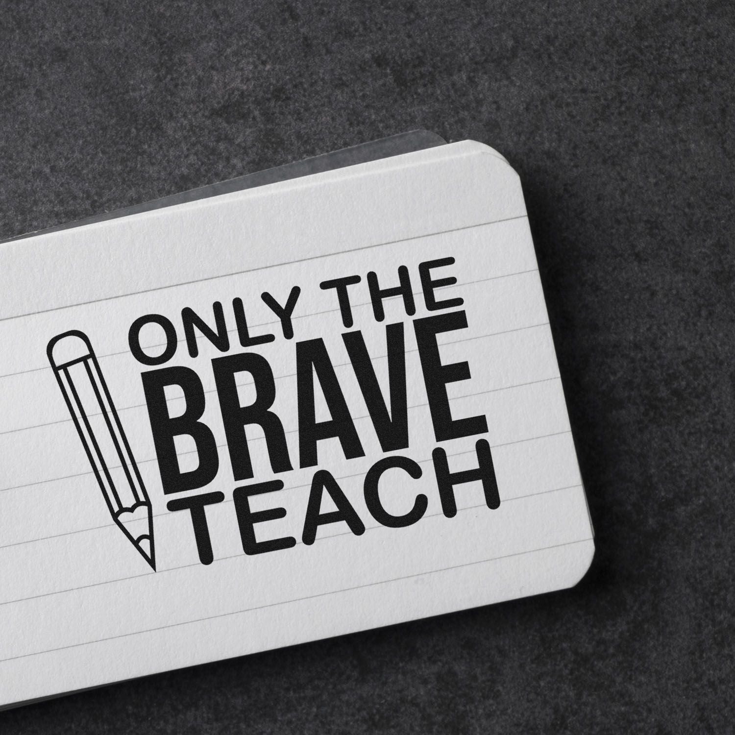 Black teaching stamp and seal design on white lined card with pencil icon and Only the Brave Teach on dark background.