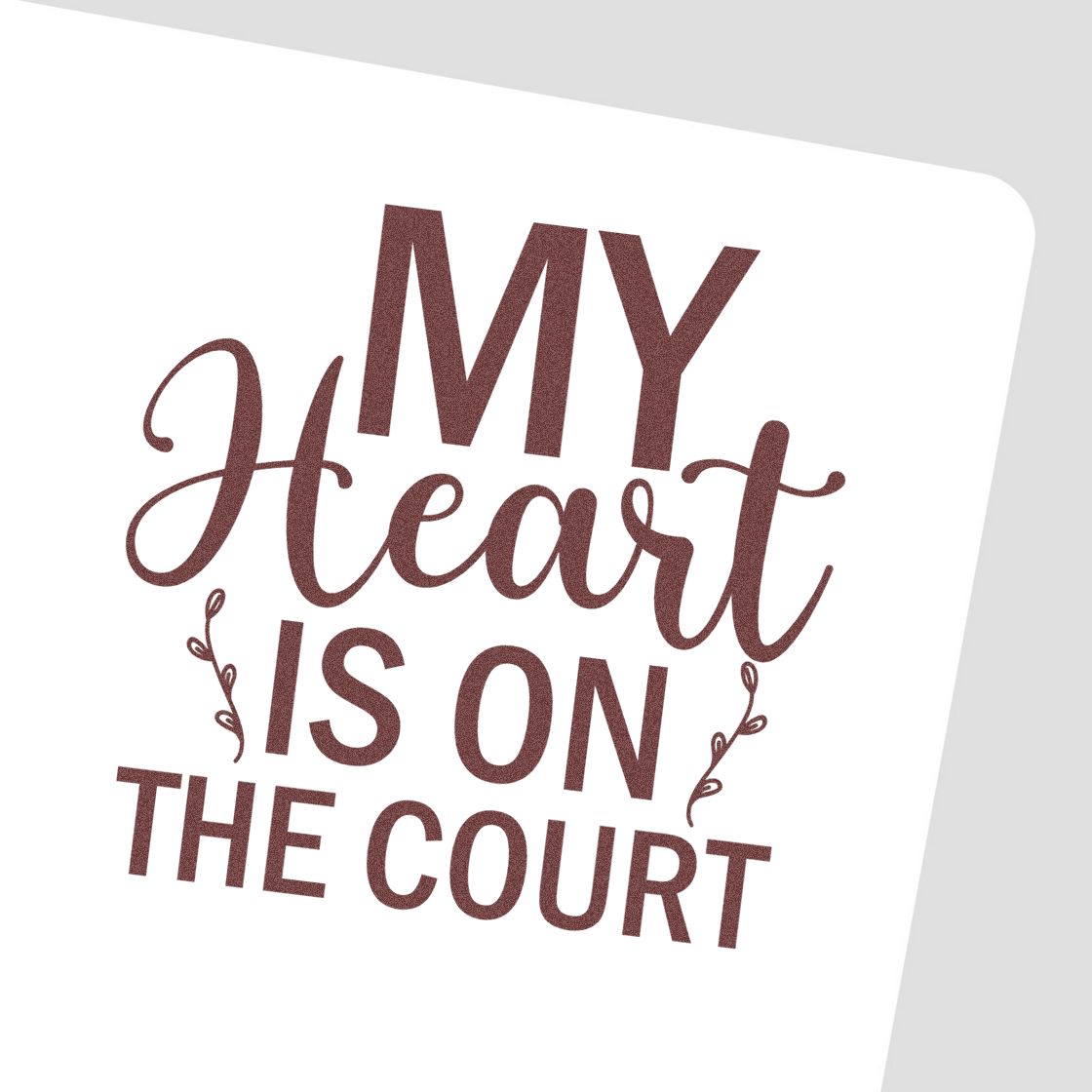 Maroon glitter stamp and seal reading My Heart Is on the Court on white card with decorative swirls