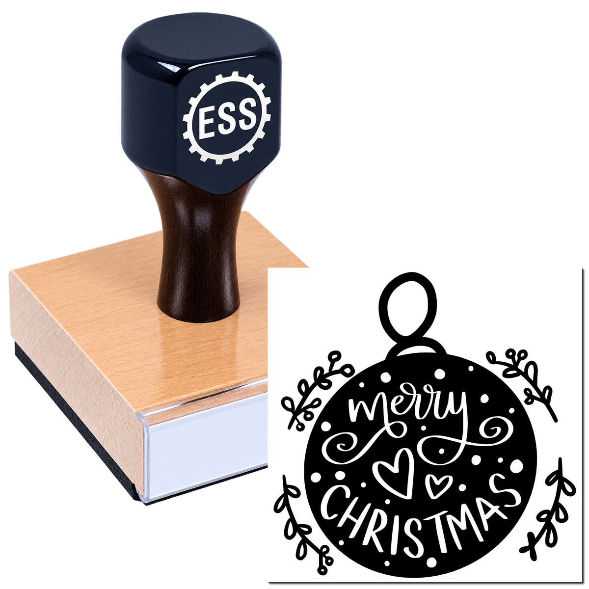 Black ESS rubber stamp on pink block, with white Merry Christmas ornament seal design.