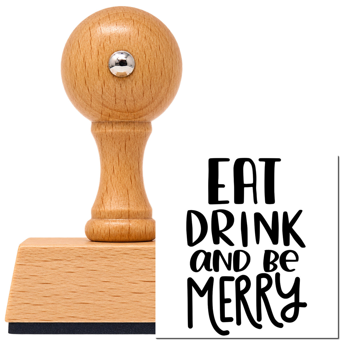 Vintage Pro beech wood stamp with a round knob handle, shown with its black Eat Drink And Be Merry Lettering imprint on white.