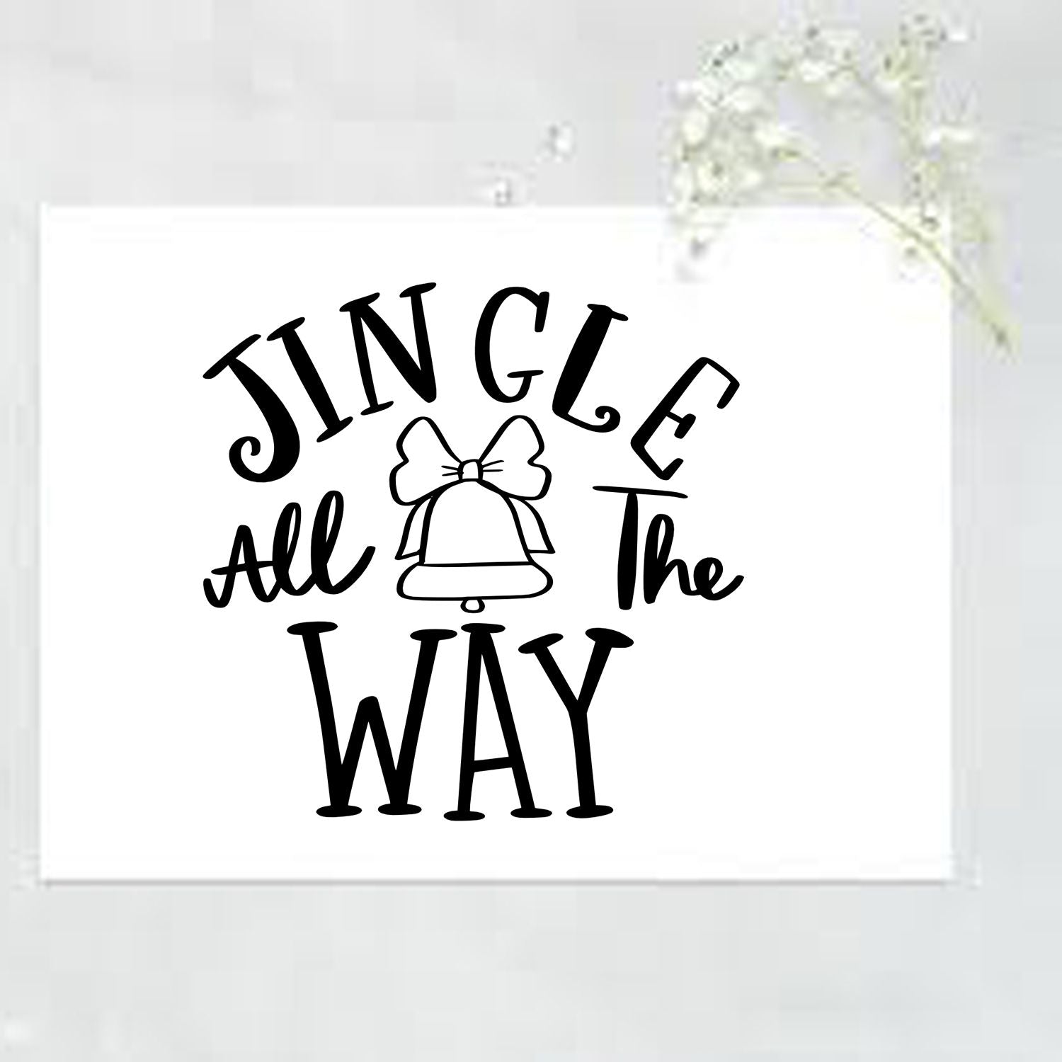 Black JINGLE All the WAY stamp with bell icon on a white seal card.