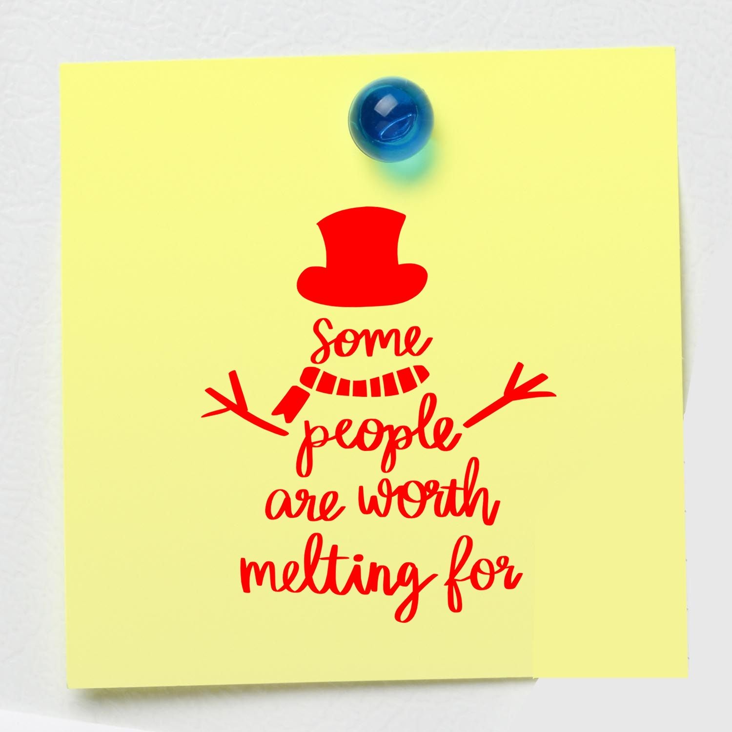 Red snowman stamp design on pale yellow note, pinned with a blue tack, with Some people are worth melting for text.