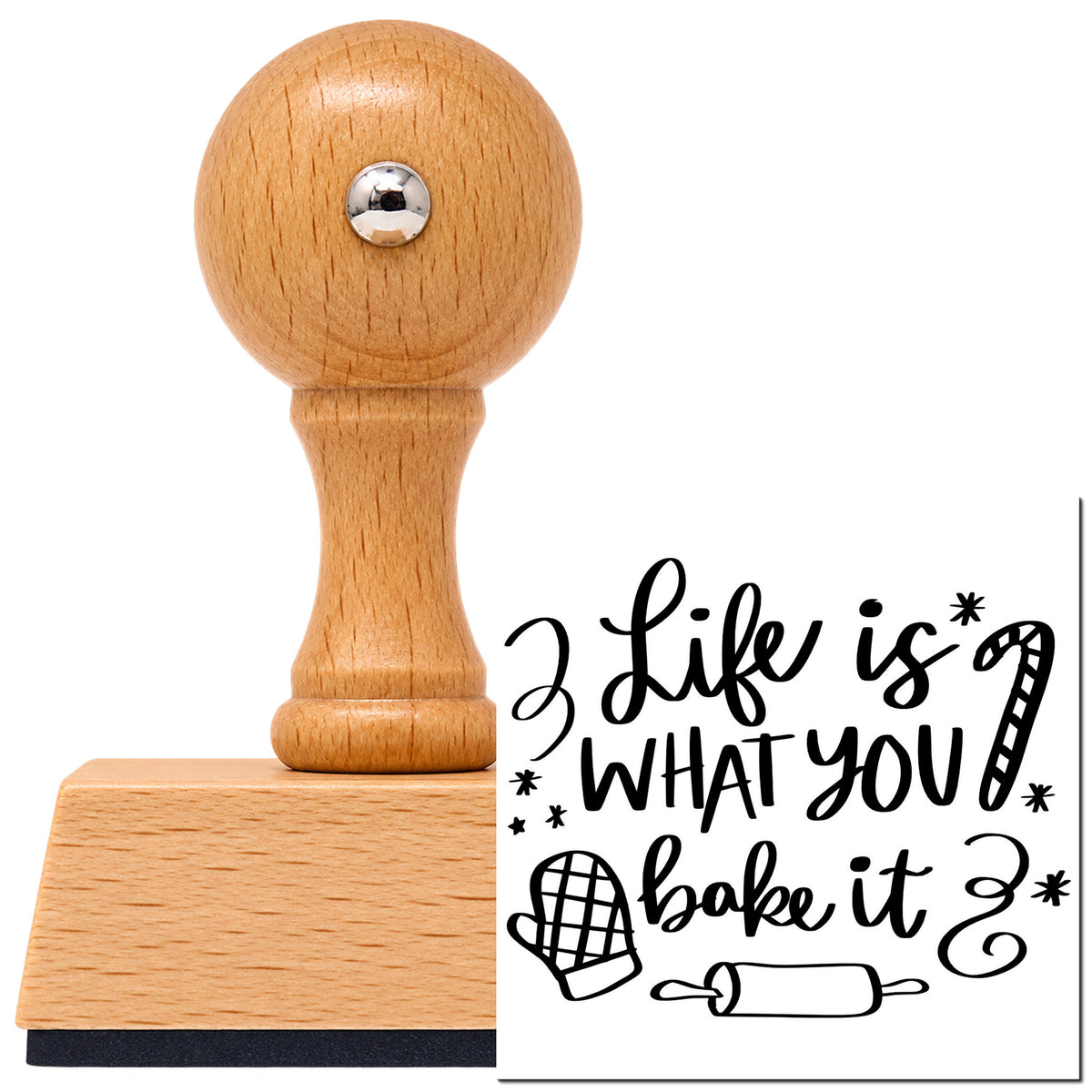 Vintage Pro beech wood stamp with a round knob handle, shown with its black Life Is What You Bake It imprint on white.