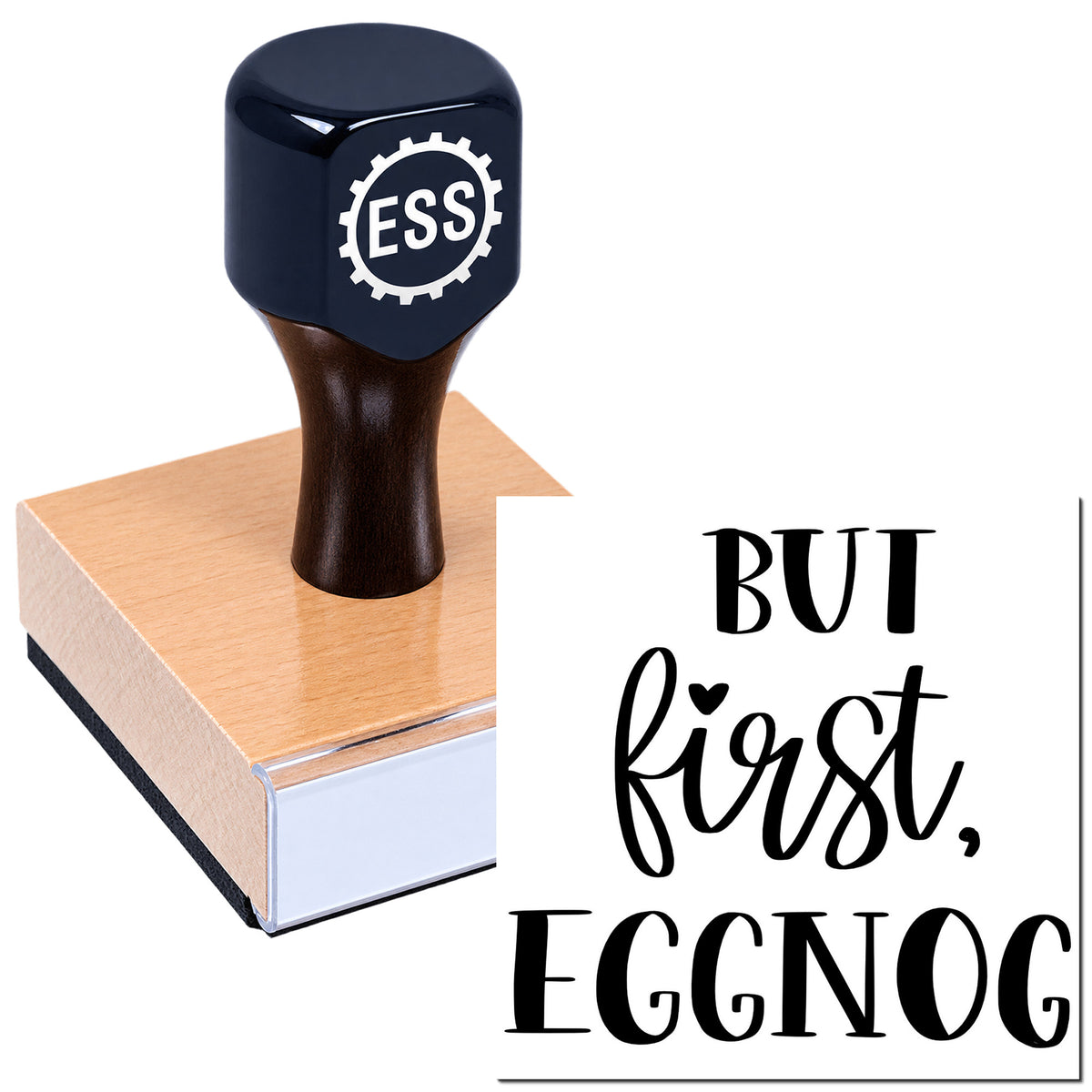 Black ESS stamp and seal on a wooden block with bold black "But first, Eggnog" lettering on white.