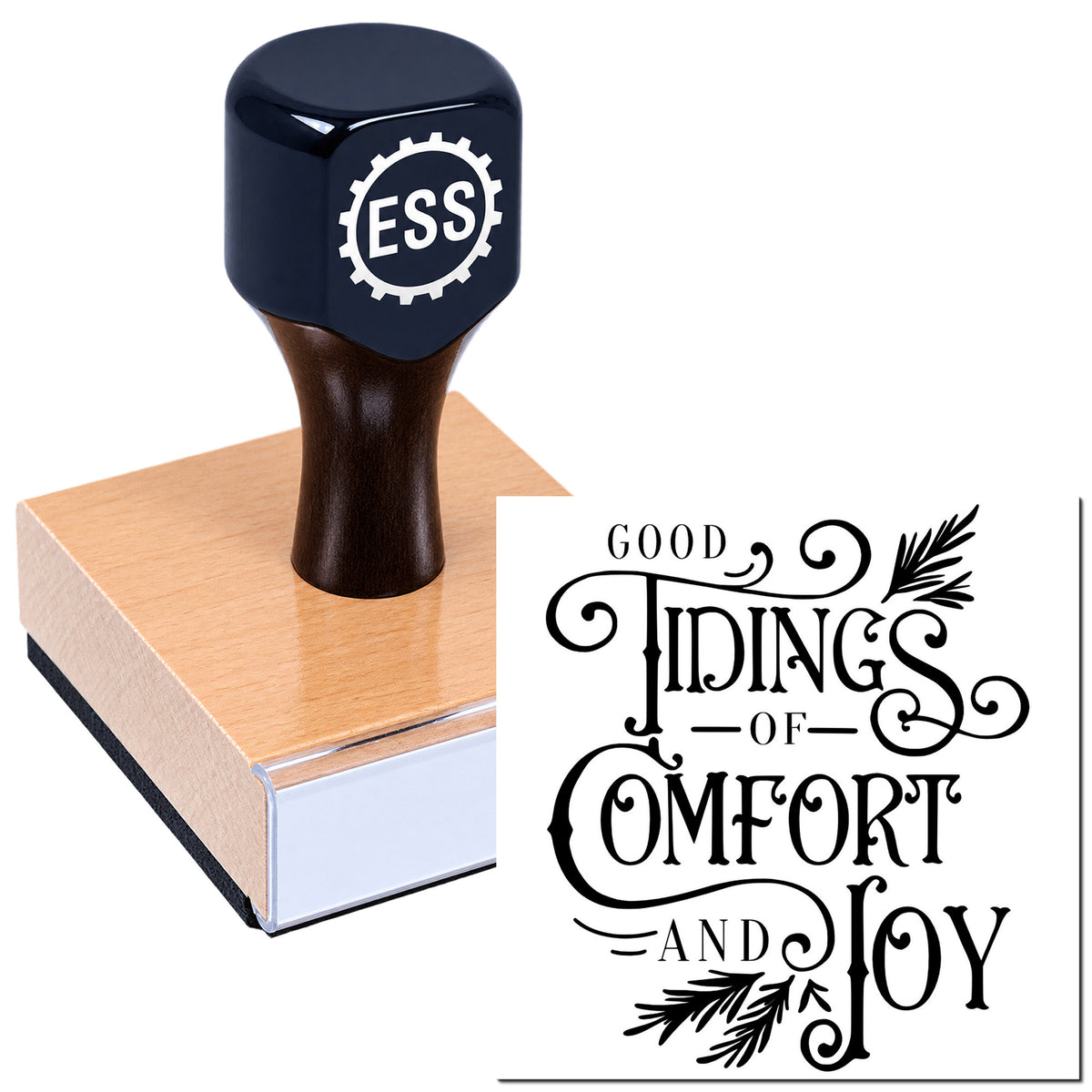 Black ESS rubber stamp on a pink wooden block with decorative "Good Things of Comfort and Joy" seal text.