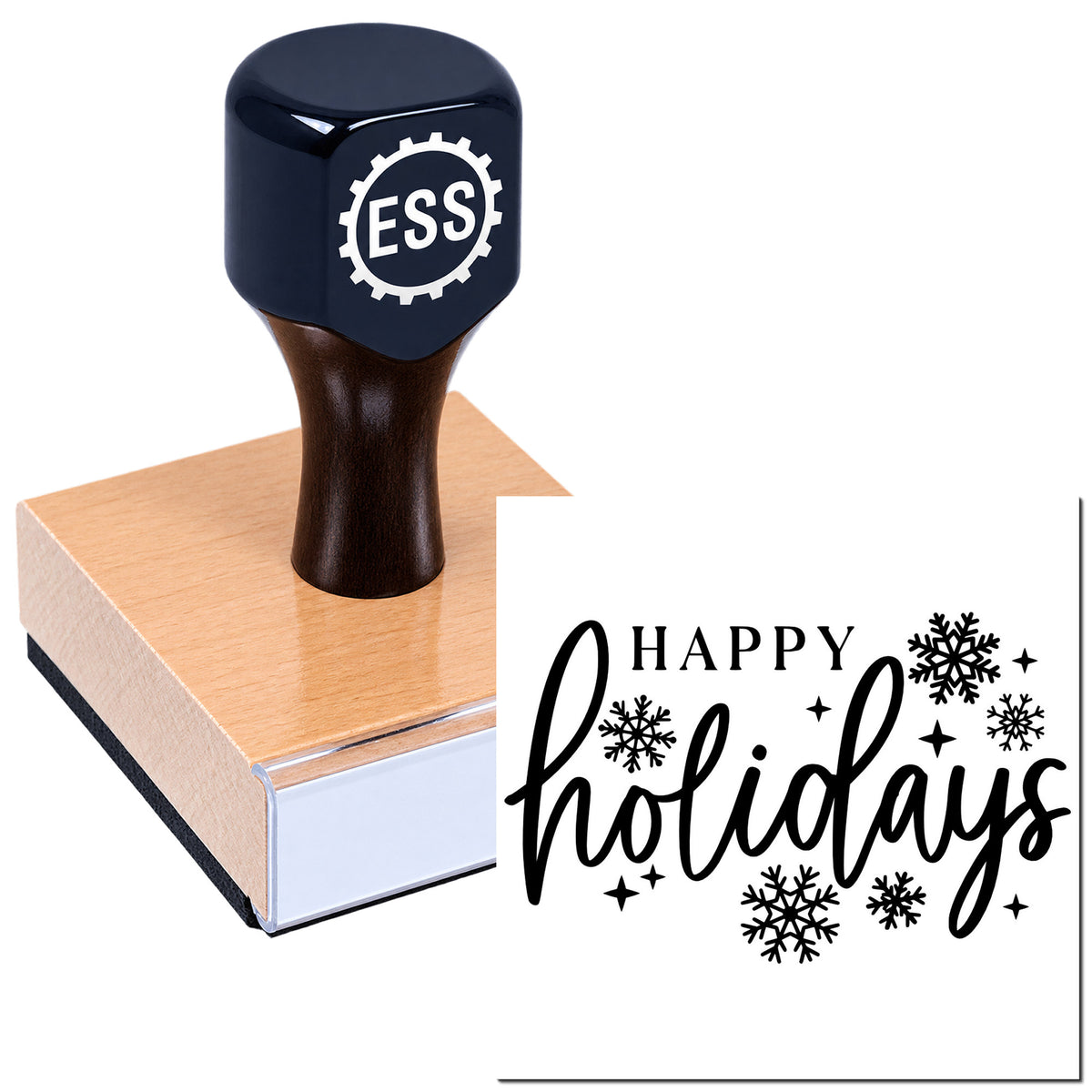 Black ESS rubber stamp and seal on wooden block, printing "Happy holidays" with black snowflakes on white.