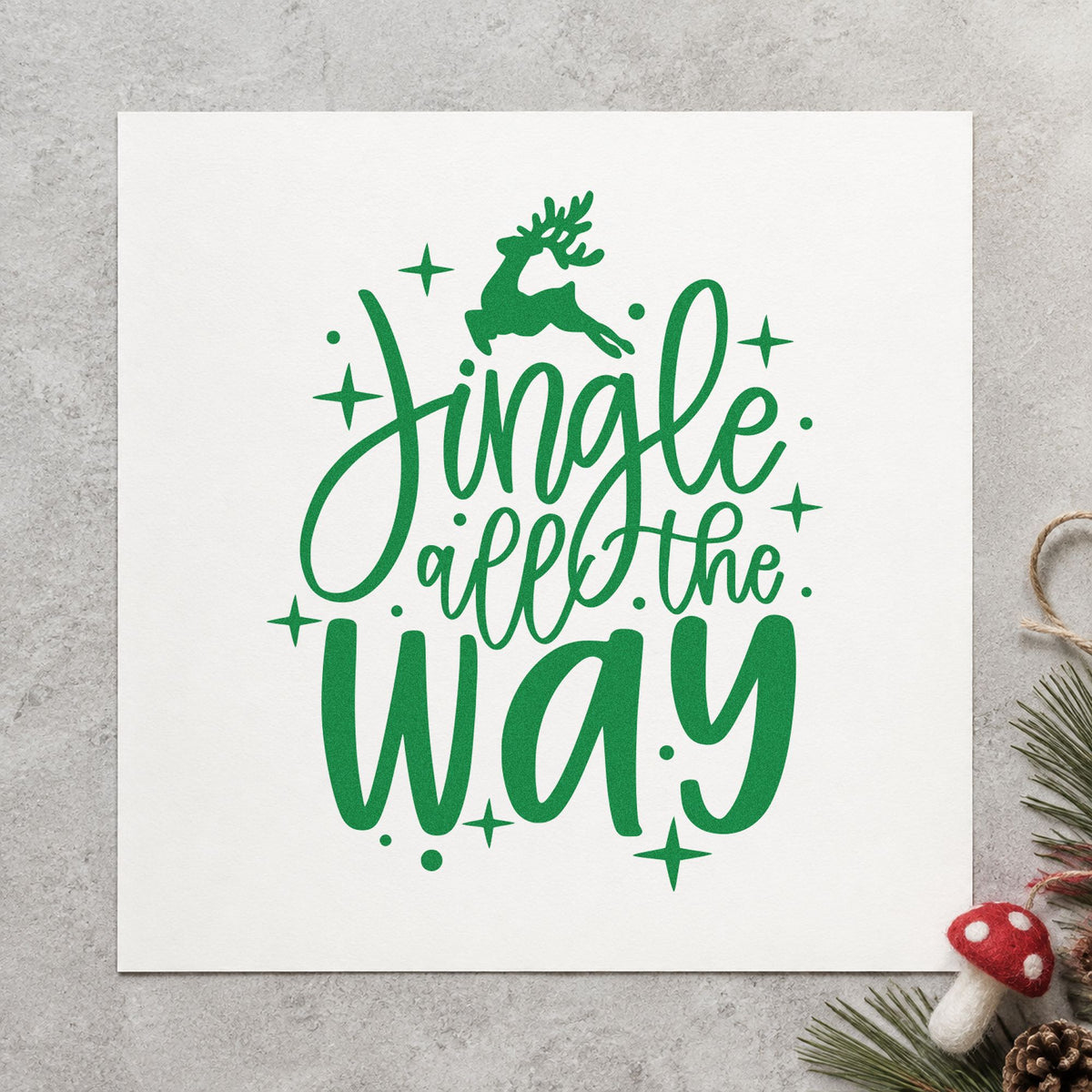 Jingle All The Way Reindeer craft stamp imprint in green ink on a handmade project, one idea being relay race wristbands.
