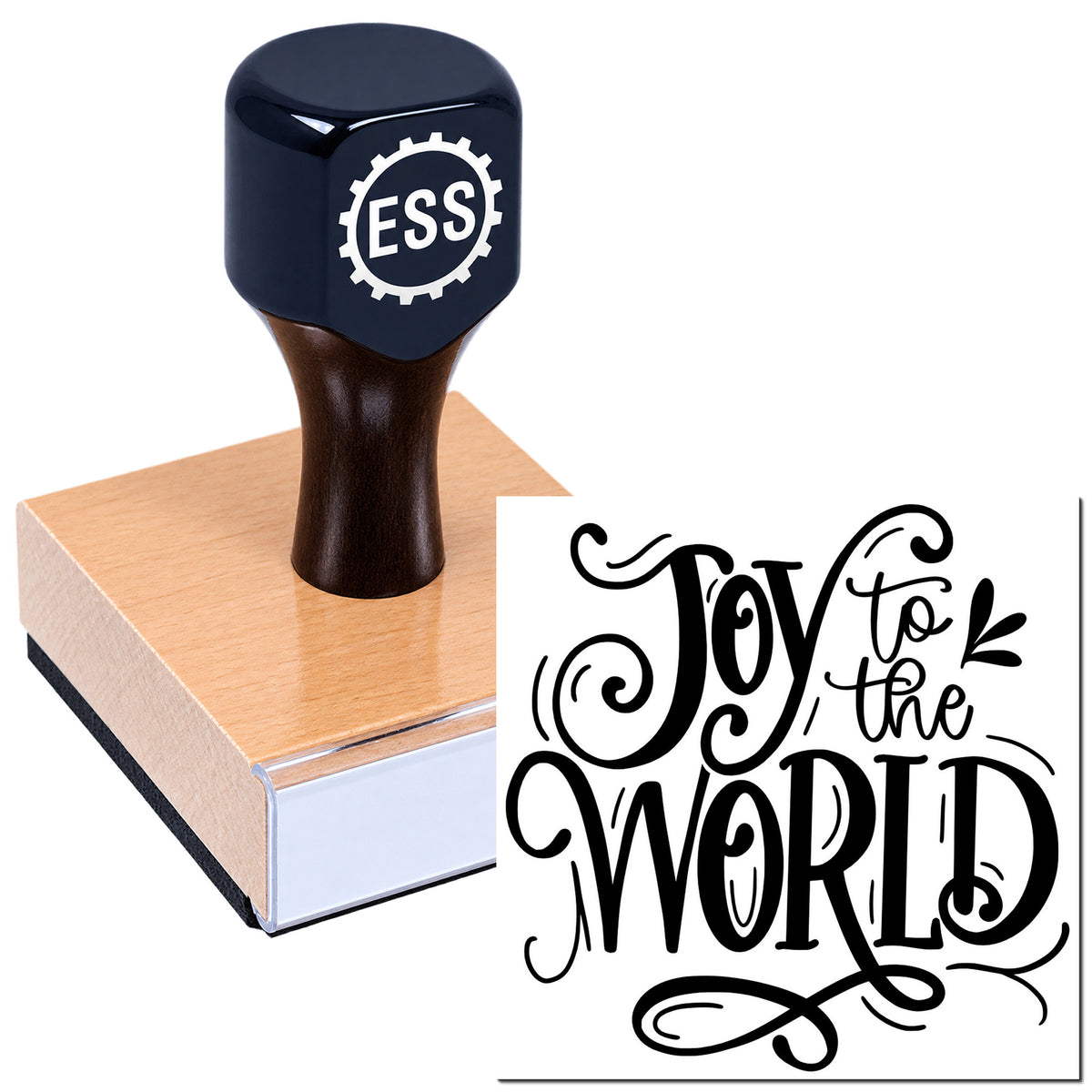 Black ESS stamp on a wooden seal block with ornate black "Joy to the World" design.