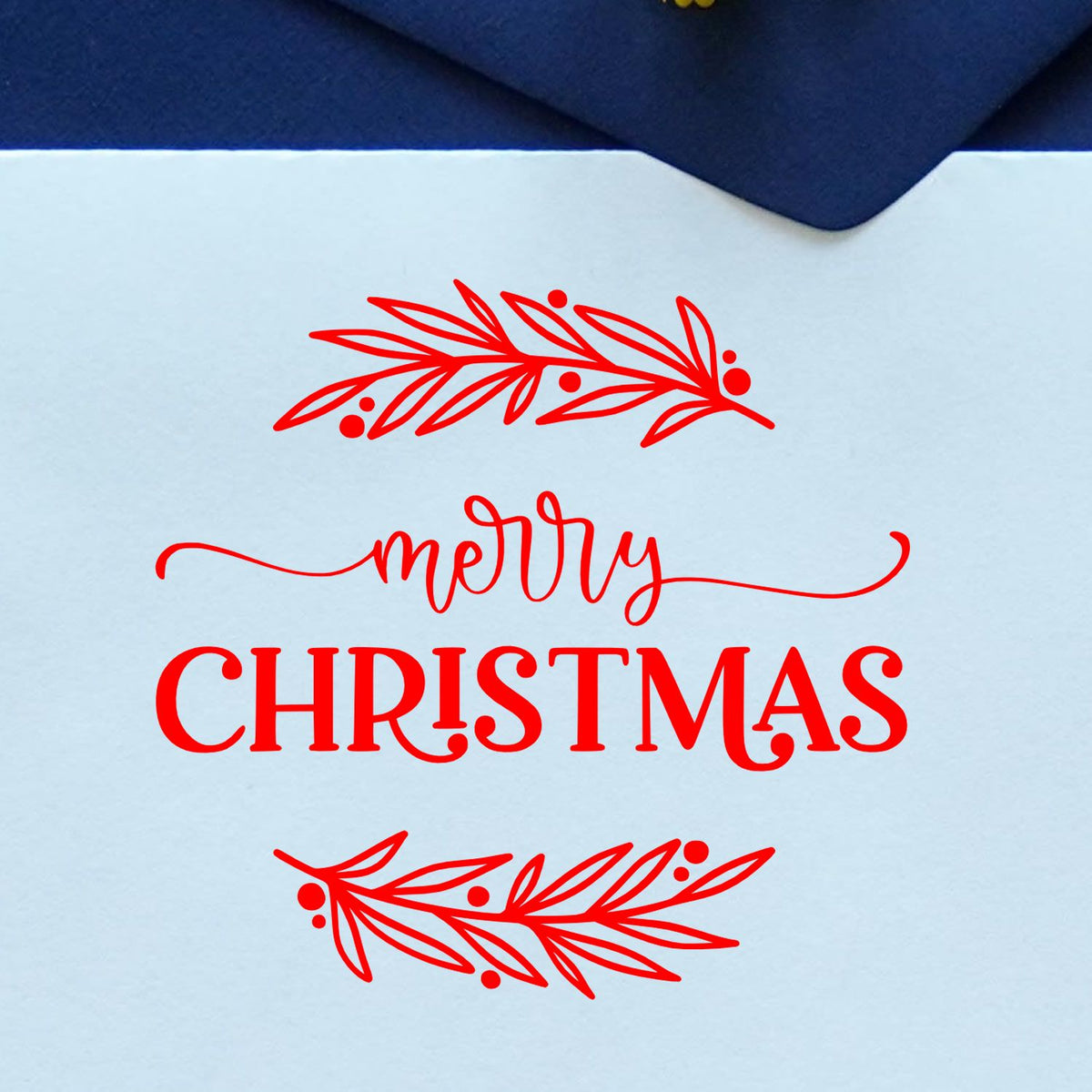 Red Merry Christmas stamp and seal design with decorative leafy sprigs on a light blue background.