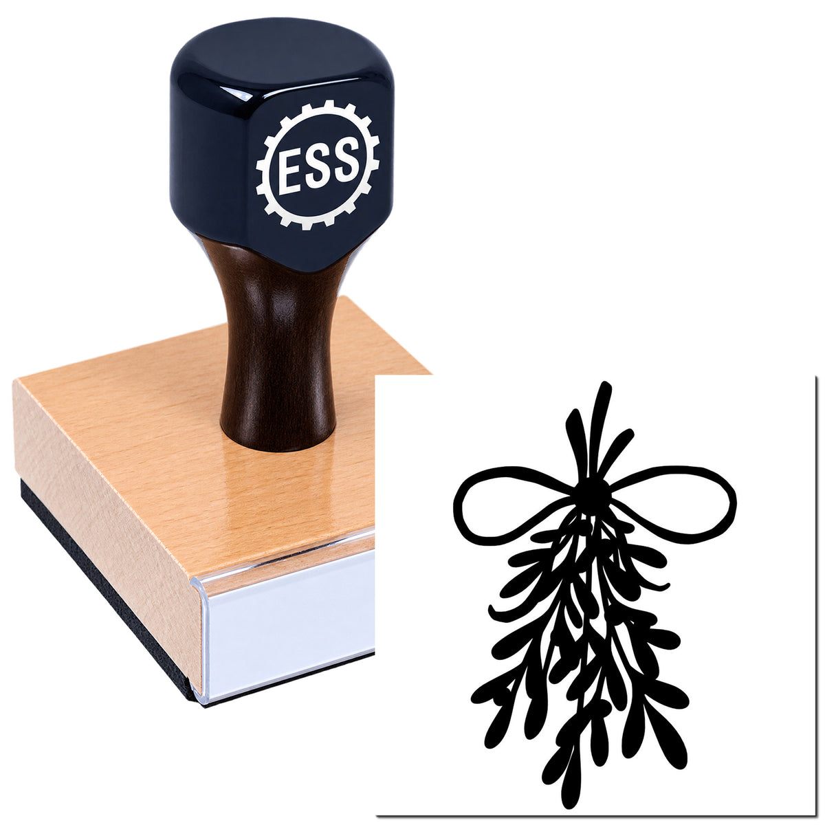 Black ESS stamp and seal product on a wooden block beside a black decorative seal design on white.