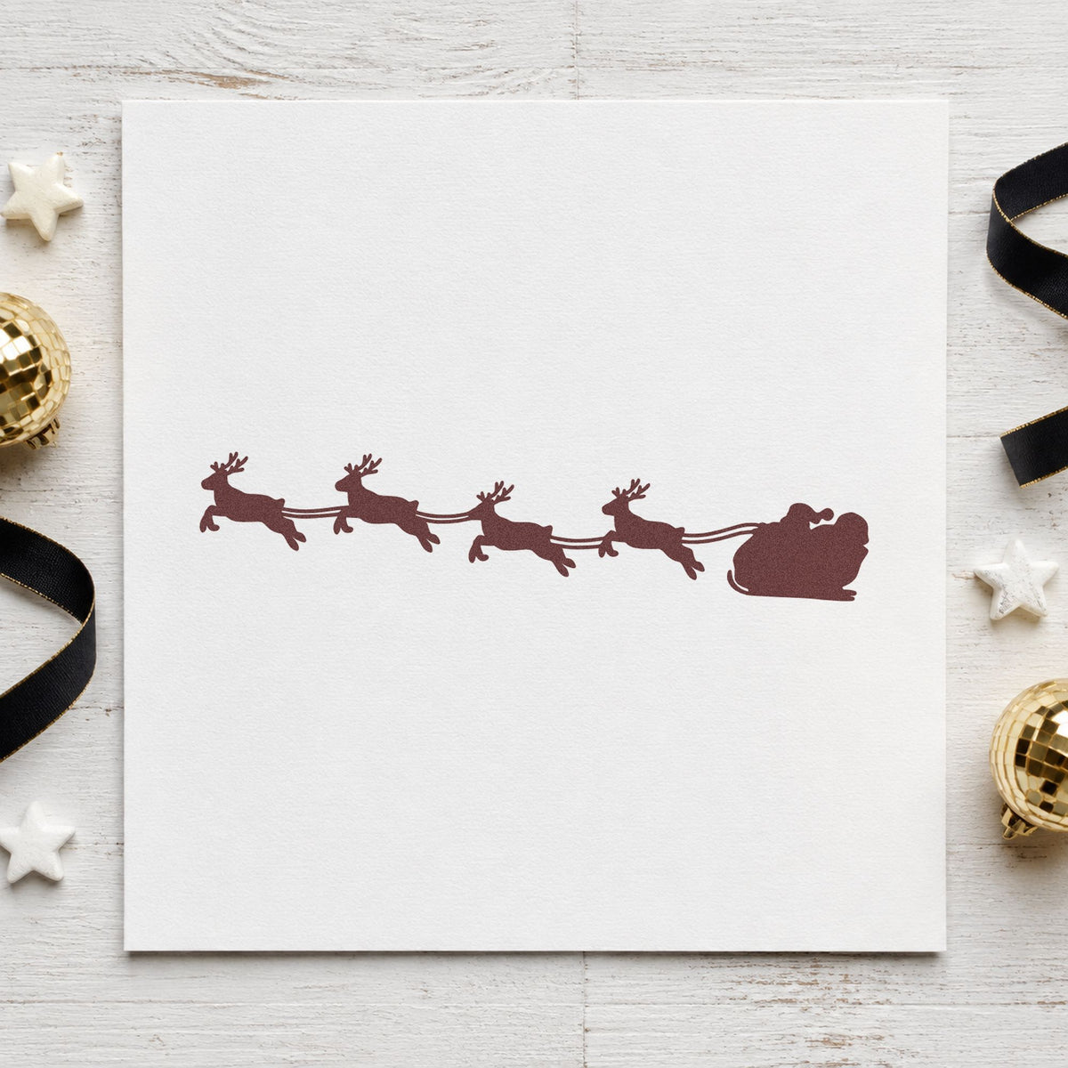Santa Sleigh Reindeer Silhouette rubber stamp printed in black ink, ready for calendar week band and similar paper crafts.