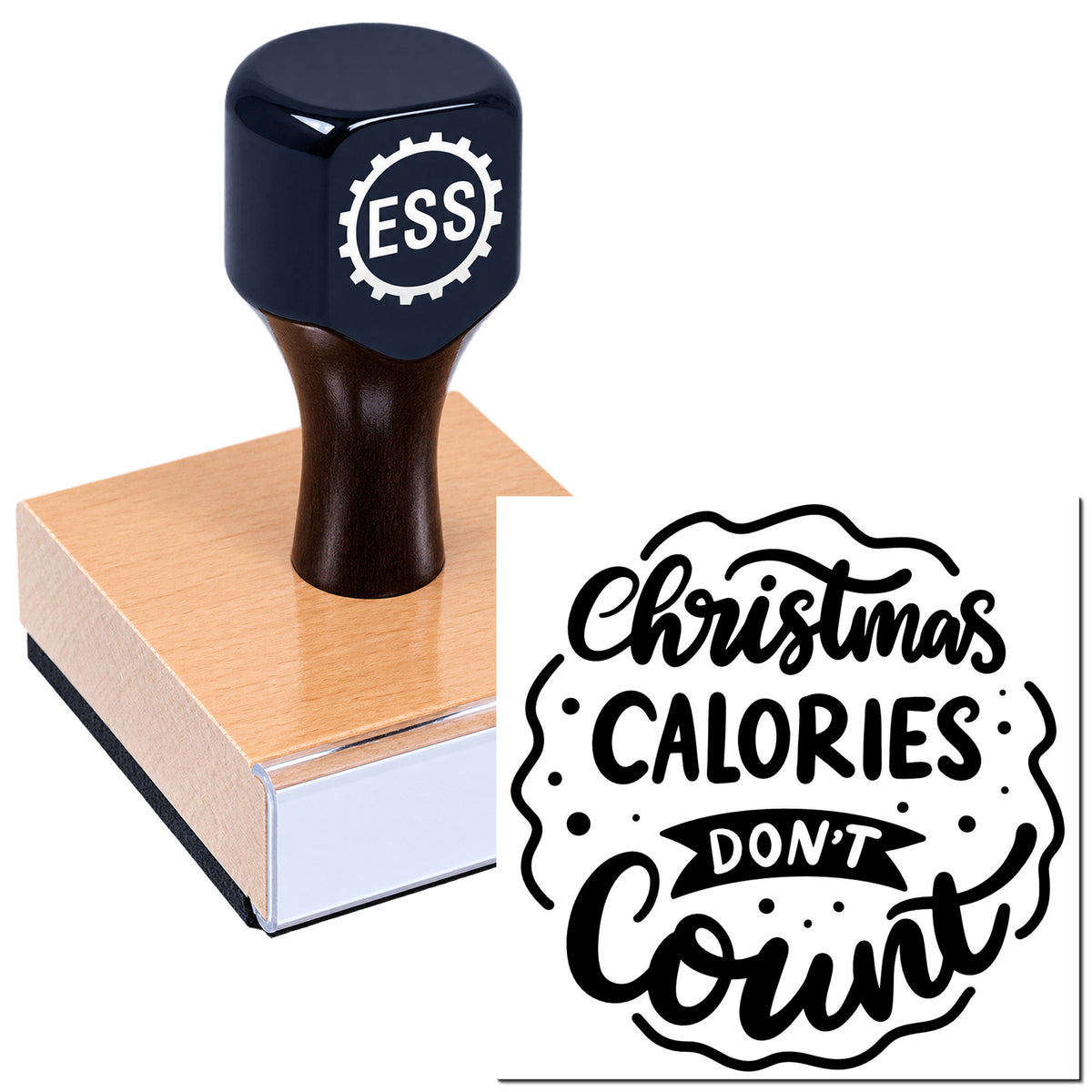 Black ESS stamp and seal on wood block, showing a white "Christmas calories don't count" design.
