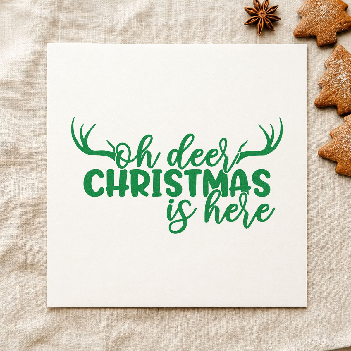 Oh Deer Christmas Is Here craft stamp imprint in green ink on a handmade project, one idea being rush order gift tags.