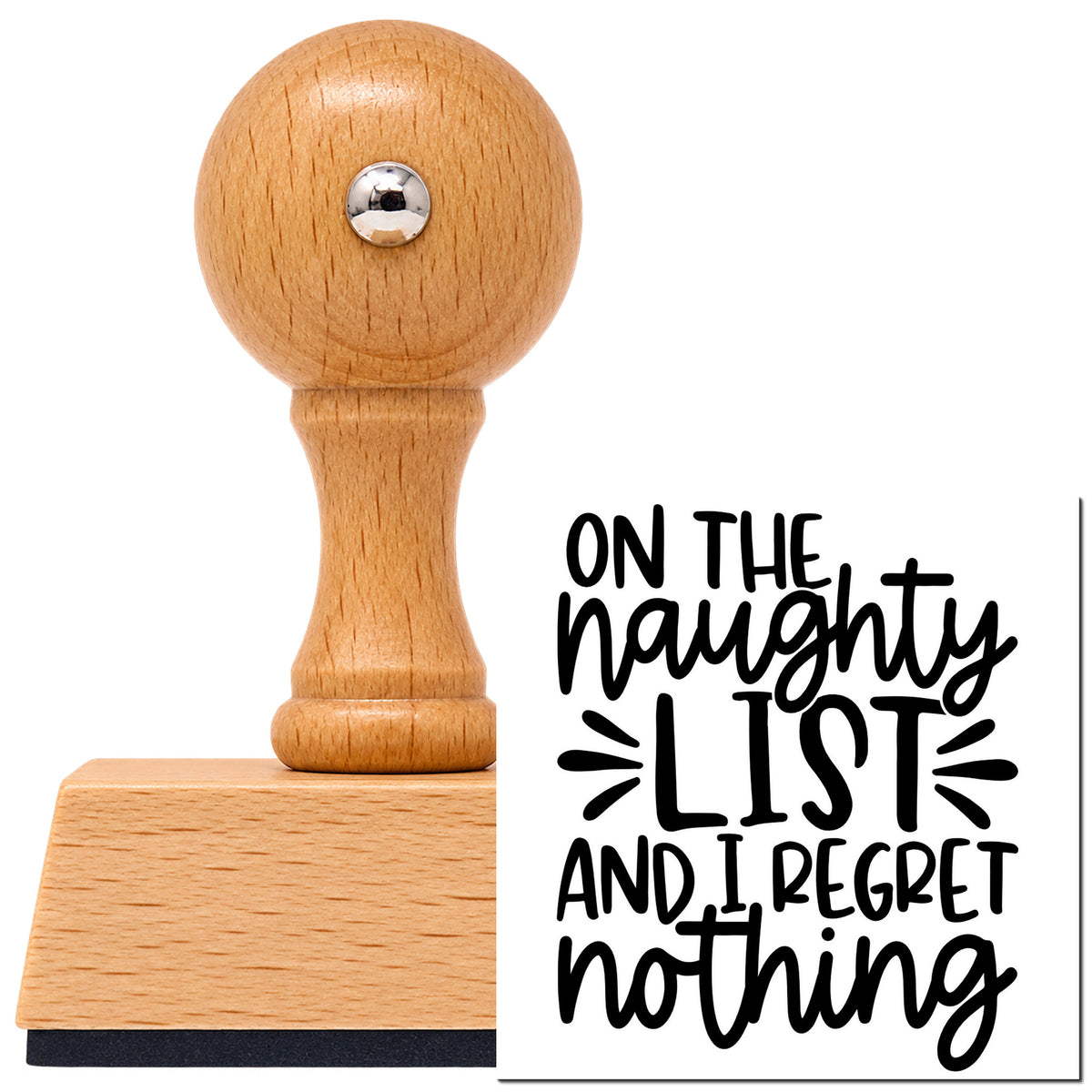 Vintage Pro beech wood stamp with a round knob handle, shown with its black Naughty List Regret Nothing imprint on white.