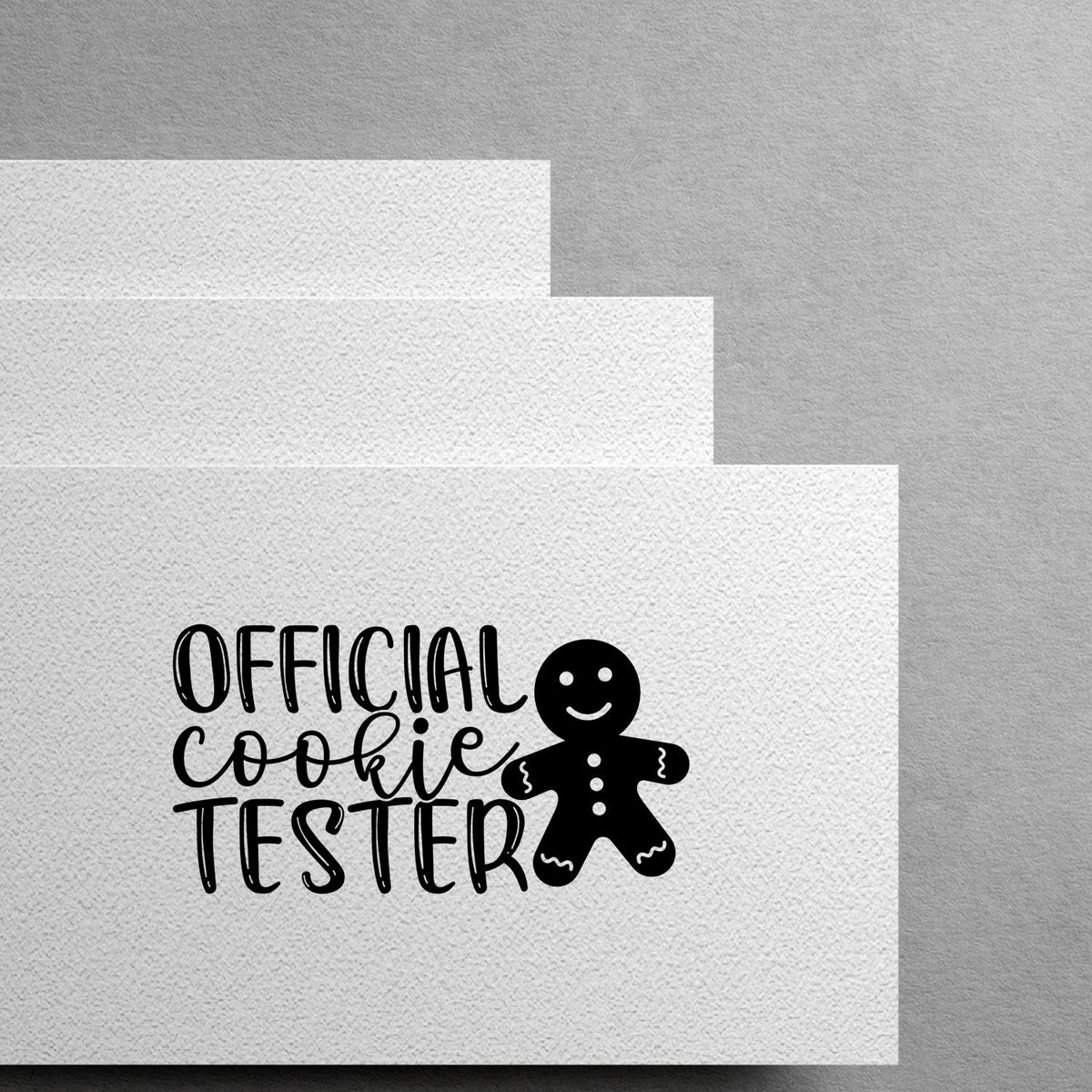 Official Cookie Tester Pre-Inked Stamp – Slim imprint stamped in black ink. “Official Cookie Tester” appears beside a smiling gingerbread figure.