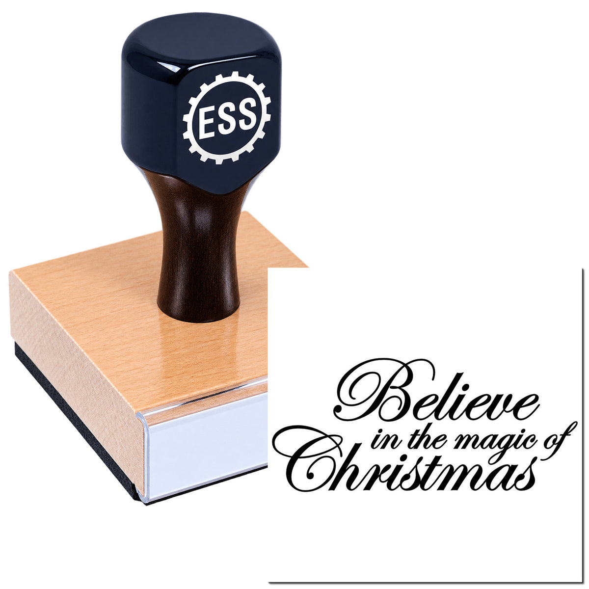 Dark blue ESS rubber stamp and wooden seal block with black script reading "Believe in the magic of Christmas"