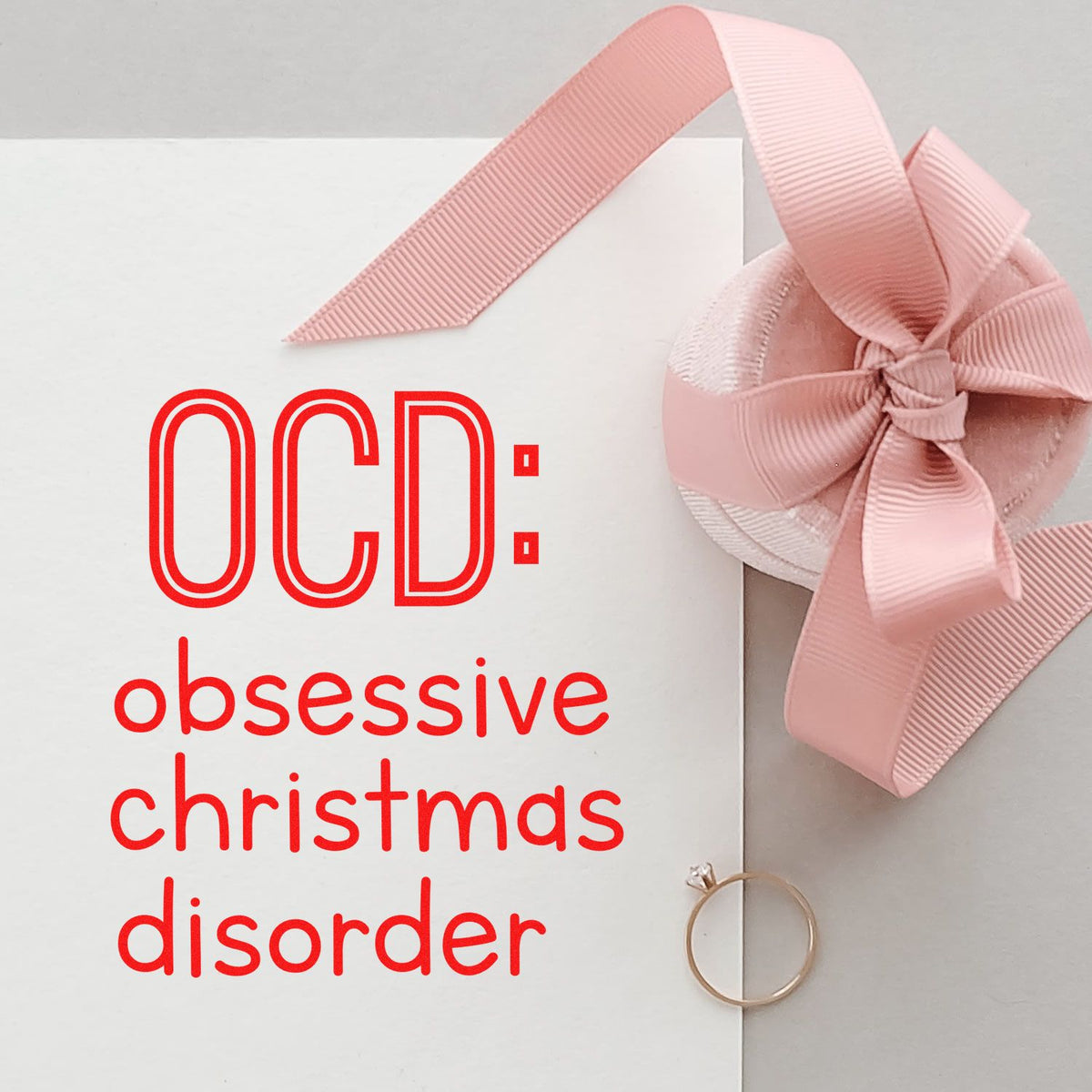 White custom stamp with red OCD: obsessive christmas disorder text and pink ribbon wax seal bow