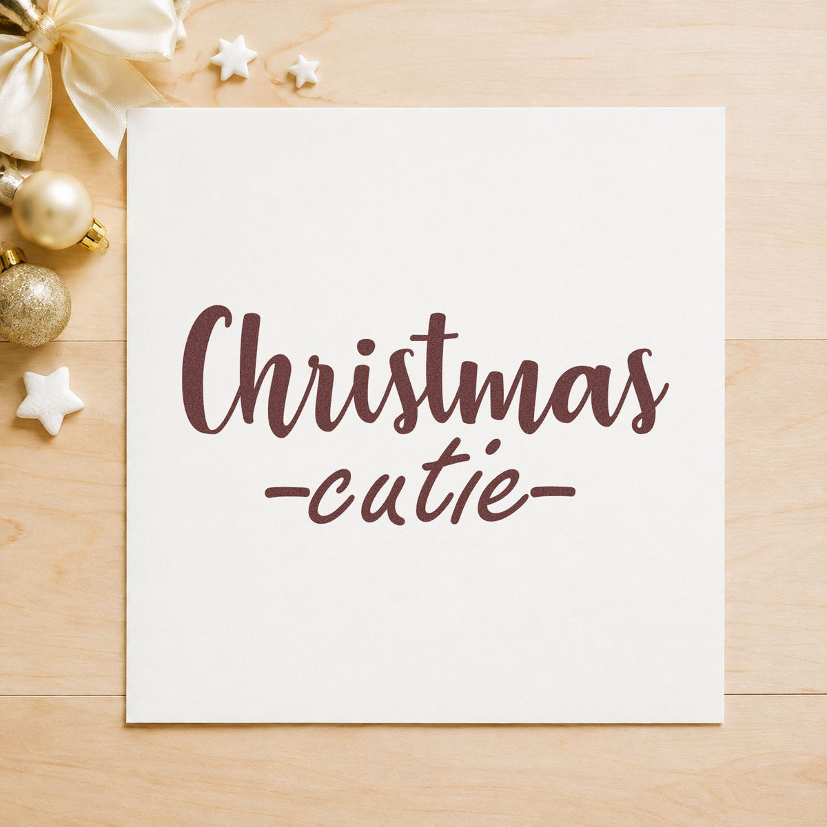 Christmas Cutie Script rubber stamp printed in brown ink, ready for milestone card sheet and similar paper crafts.