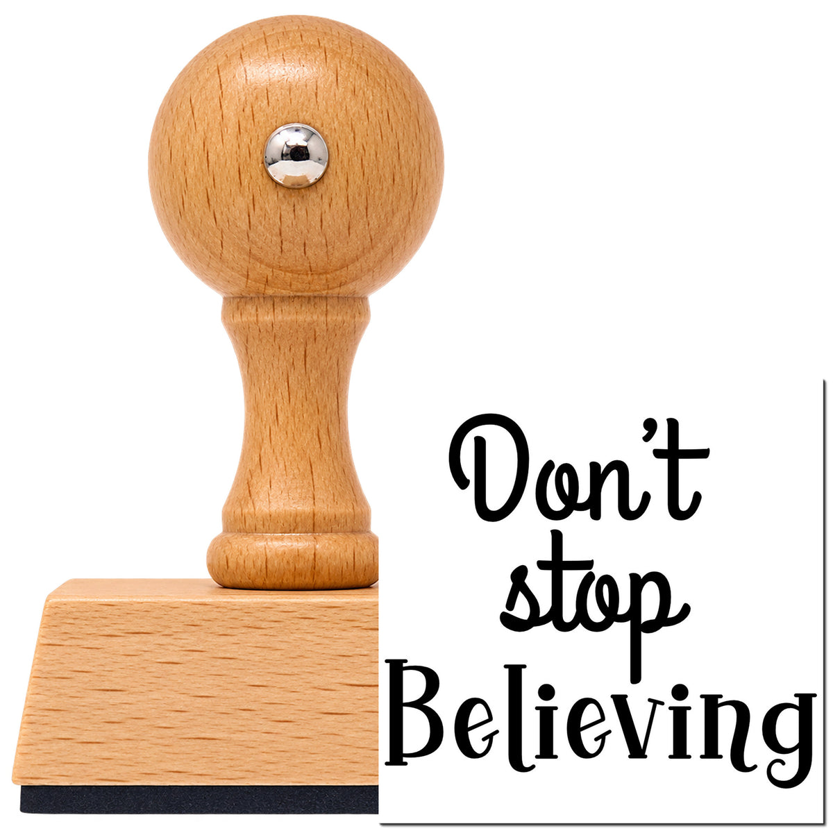 Vintage Pro beech wood stamp with a round knob handle, shown with its black Don't Stop Believing Lettering imprint on white.