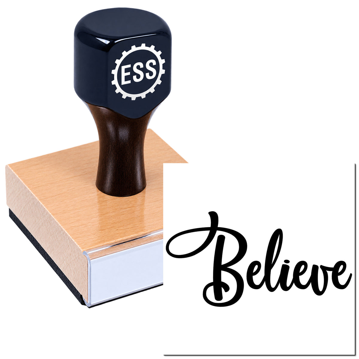 Black ESI rubber stamp on wooden block with cursive "Believe" seal impression.