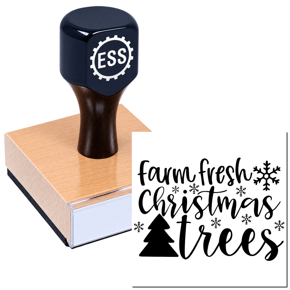 Black ESS stamp and seal on tan wooden block, printing "farm fresh Christmas trees" with snowflakes and pine tree.