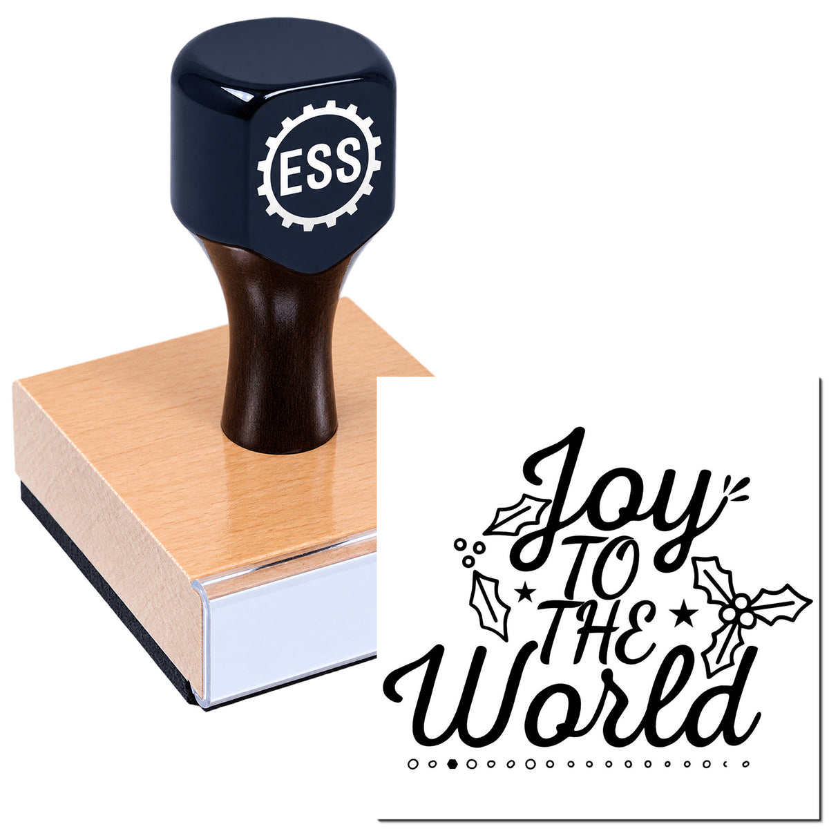 Dark navy ESS seal stamp on wooden block, with black "Joy to the World" holiday imprint and holly accents.