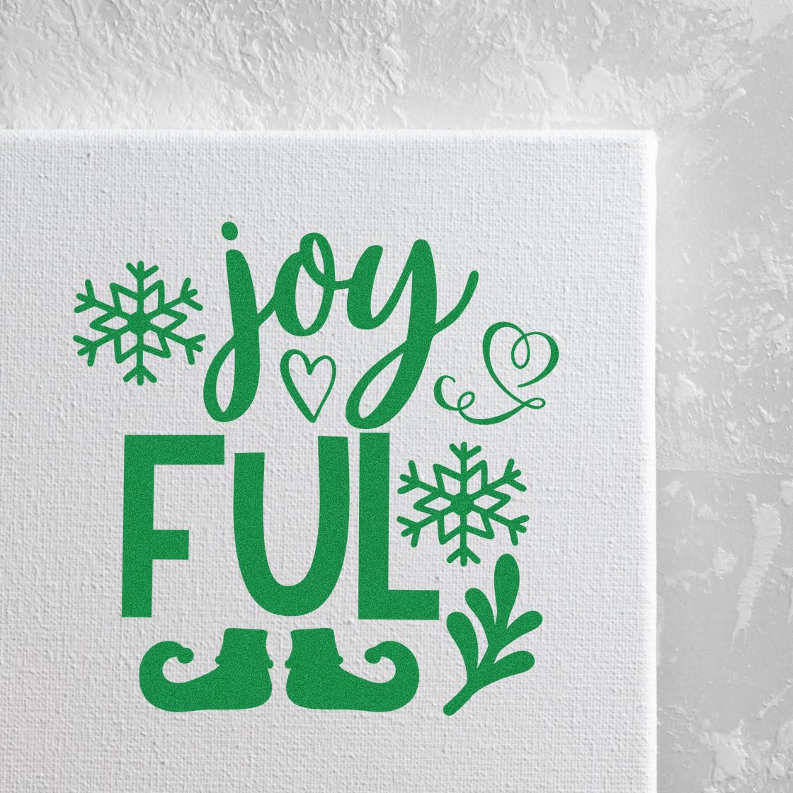Green holiday stamp and seal with joy ful, snowflakes, heart, and elf boots on white canvas.