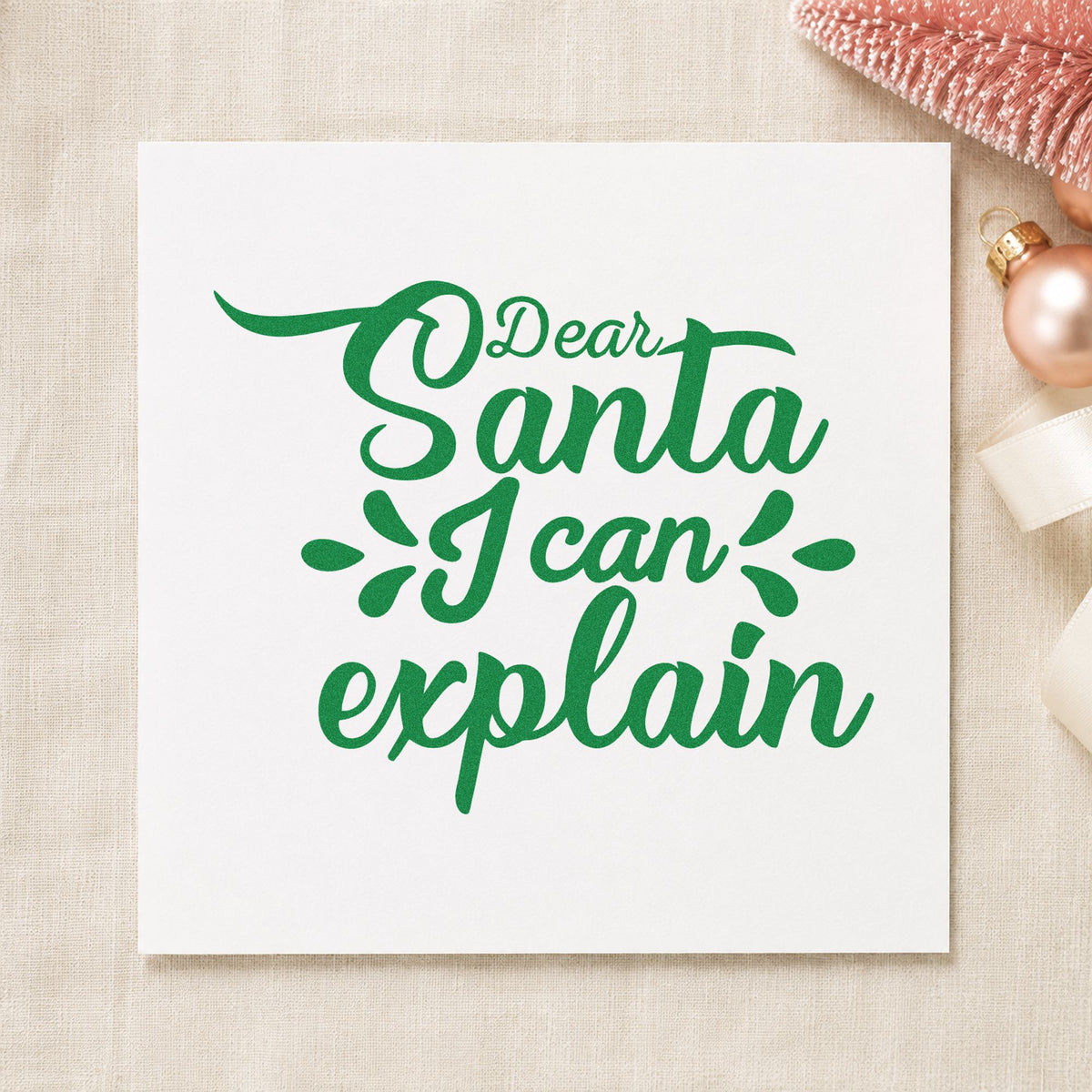 Dear Santa I Can Explain craft stamp imprint in green ink on a handmade project, one idea being keychain gift tags.