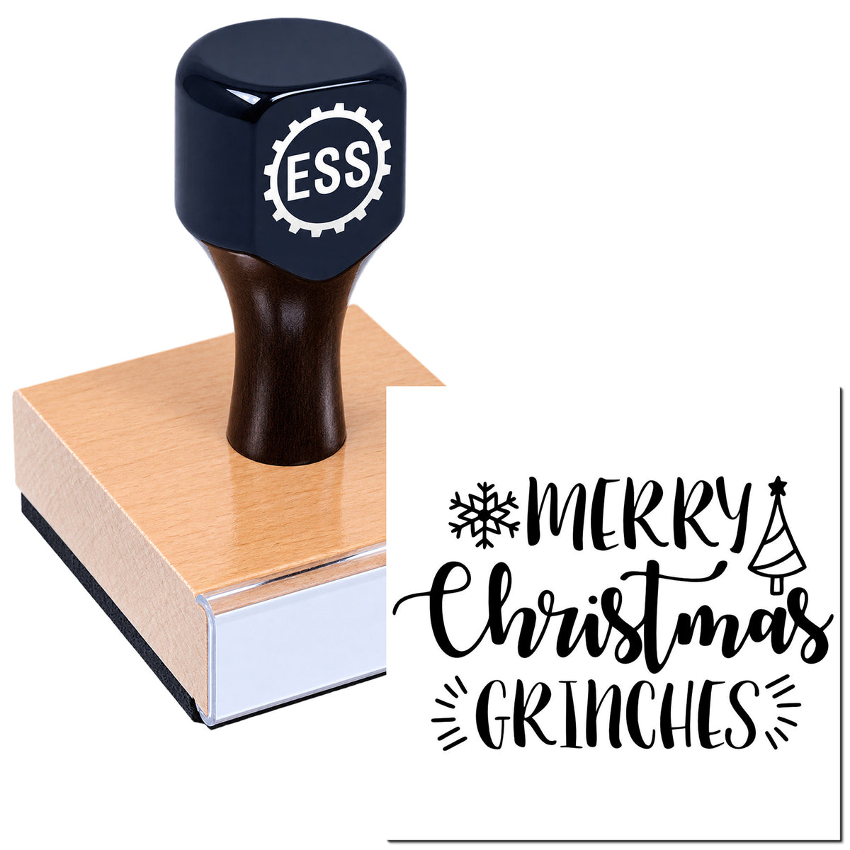Dark blue ESS rubber stamp on a wooden block beside a black Merry Christmas Grinches seal with snowflake and tree.