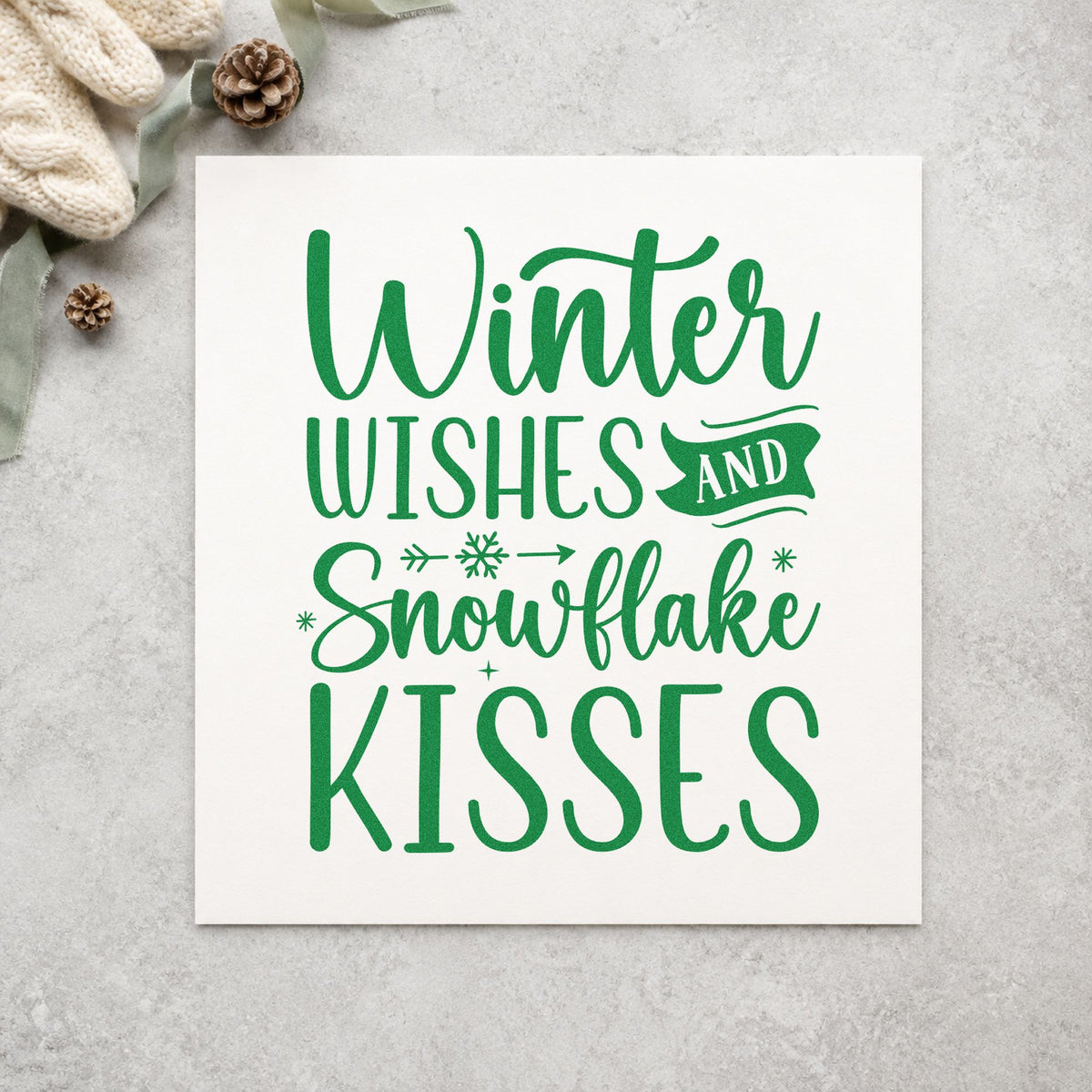 Winter Wishes Snowflake Kisses craft stamp imprint in green ink on a handmade project, one idea being rhyme note tags.
