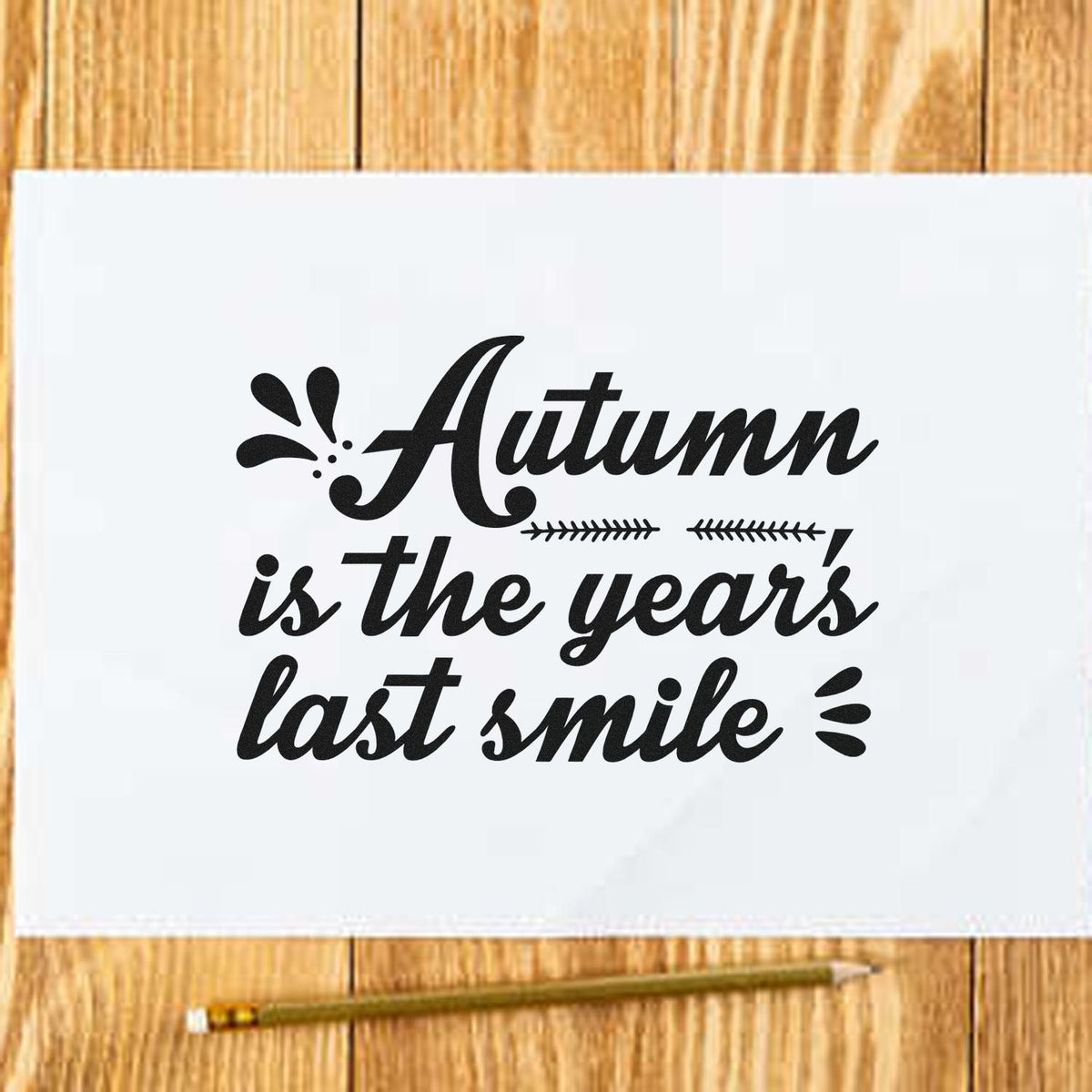 Autumn Year's Last Smile Stamp - Premium Vintage Pro Wooden imprint stamped in black ink. "Autumn Is the Year's Last Smile" appears in bold italic lettering with leafy accents.