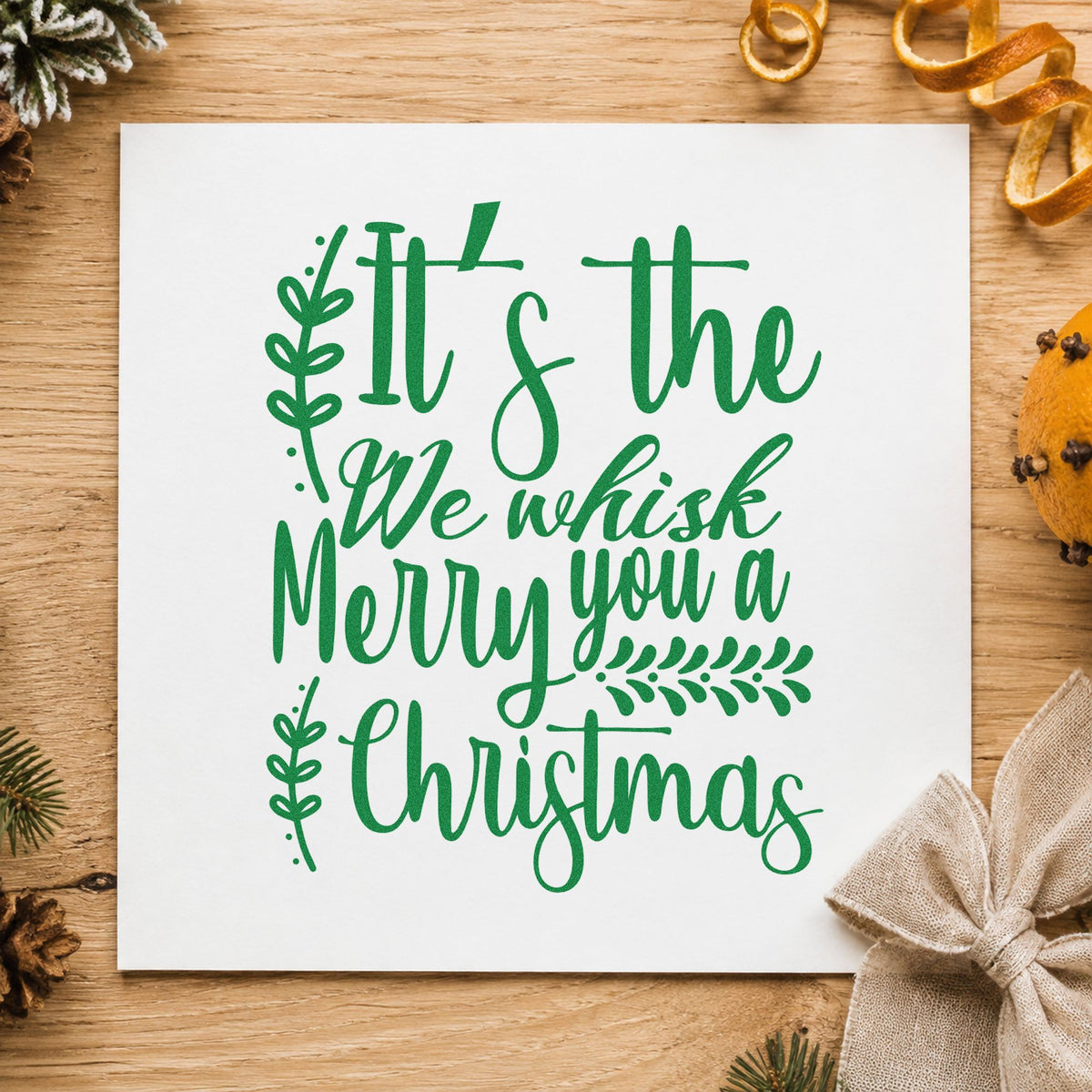 We Whisk Merry Christmas craft stamp imprint in green ink on a handmade project, one idea being mix jar gift tags.