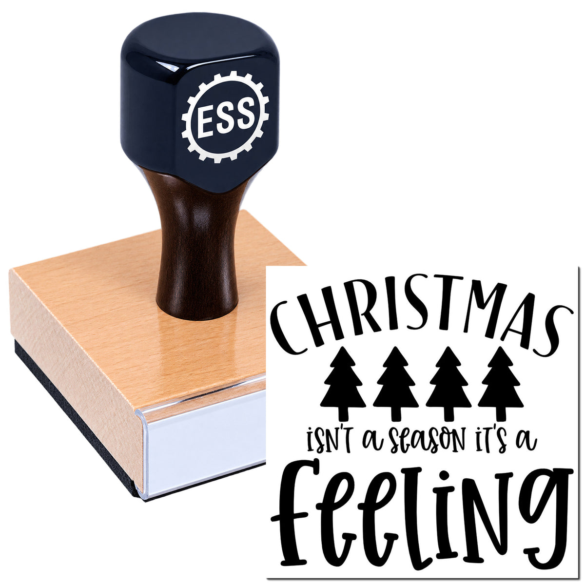Black ESS self-inking stamp with pink pad and Christmas seal design reading "Christmas isn't a season, it's a feeling."