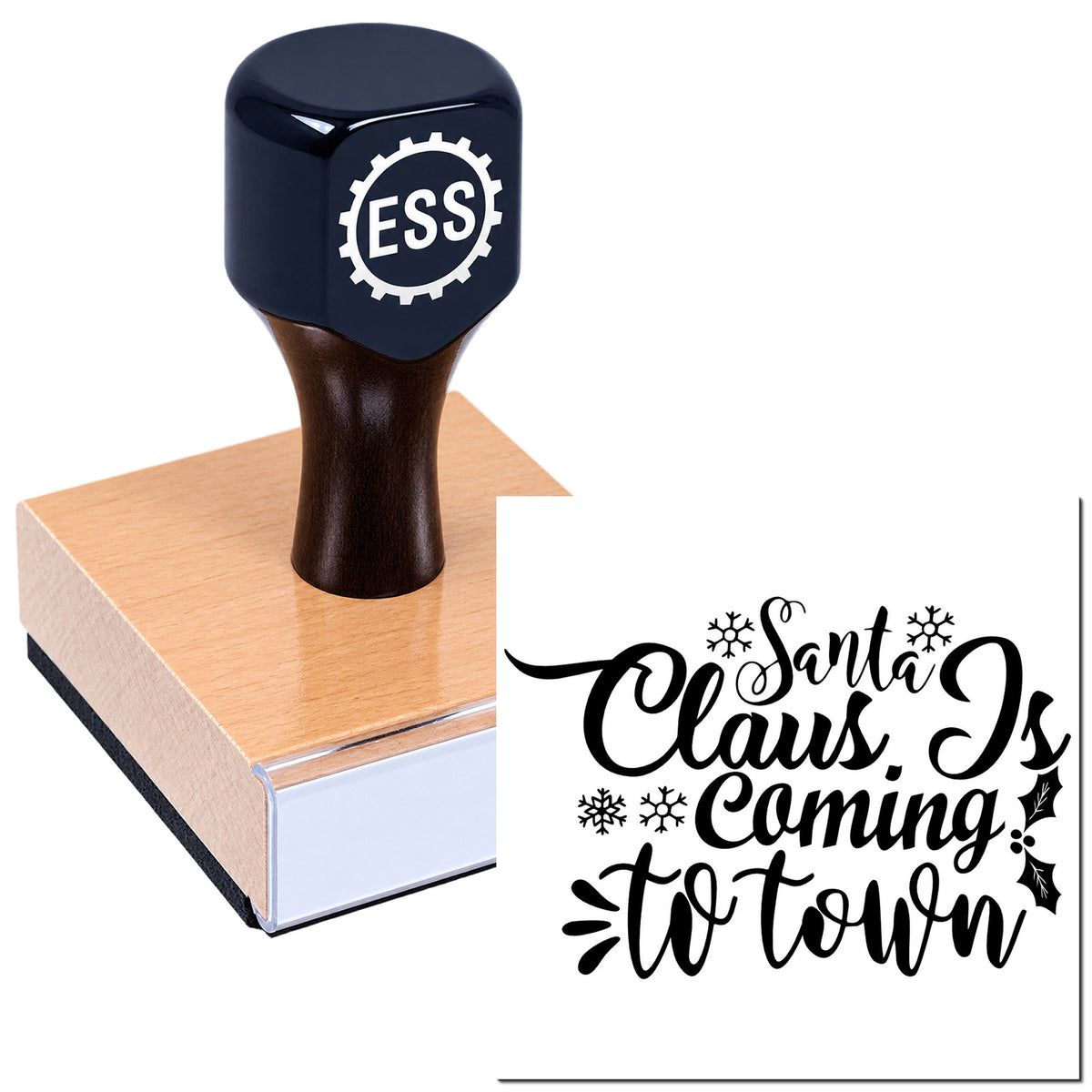 Dark navy ESS stamp and seal on a wooden block, showing black "Santa Claus Is Coming to Town" holiday script with snowflakes.