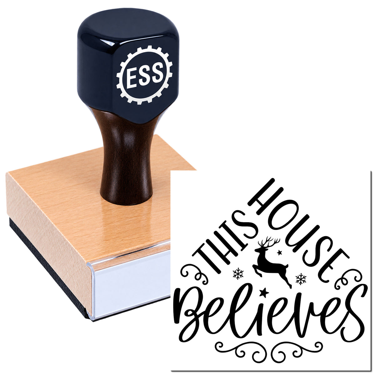 Black self-inking stamp on a wooden block with a white "This House Believes" deer and snowflake seal design.