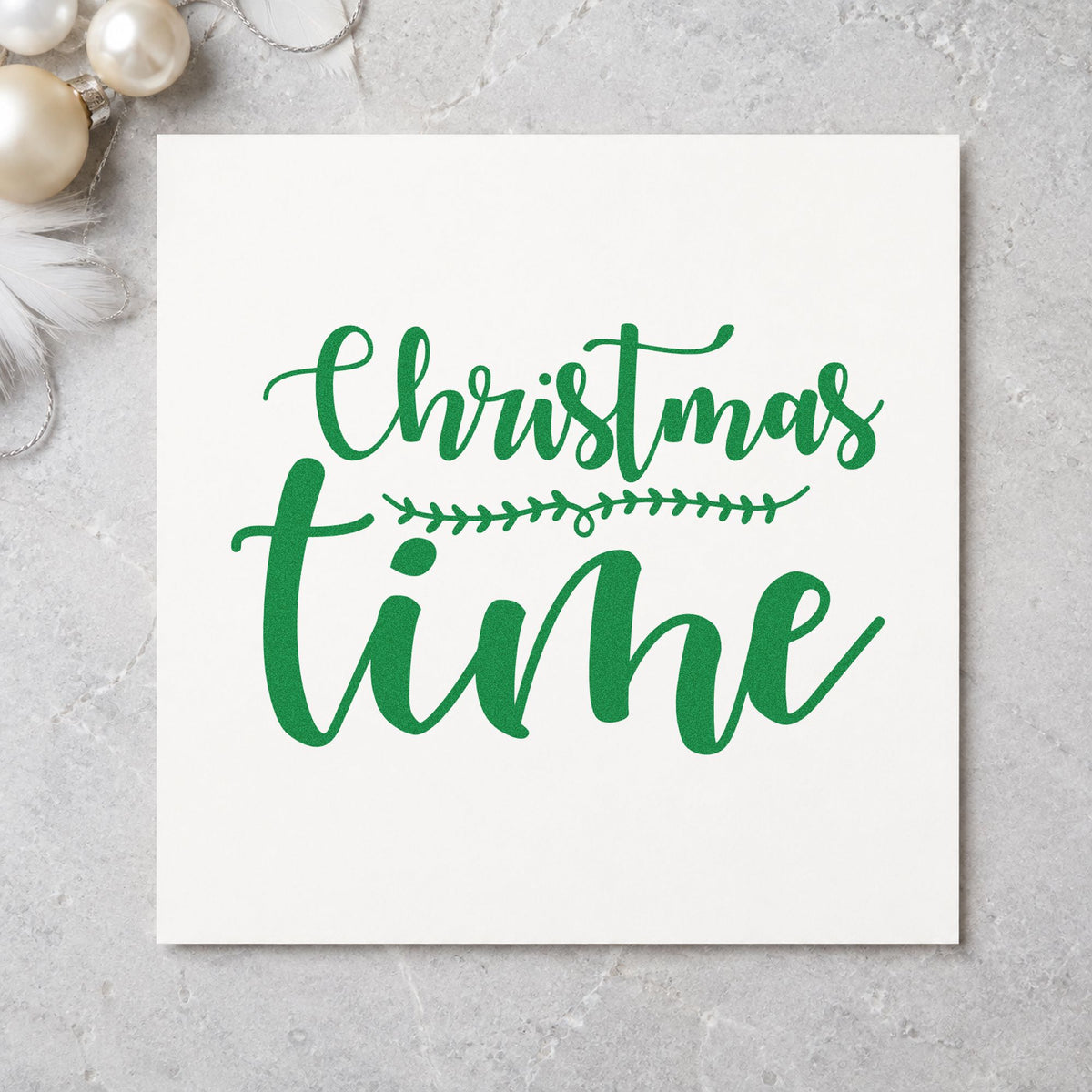 Christmas Time Leaf Divider craft stamp imprint in green ink on a handmade project, one idea being split face gift tags.