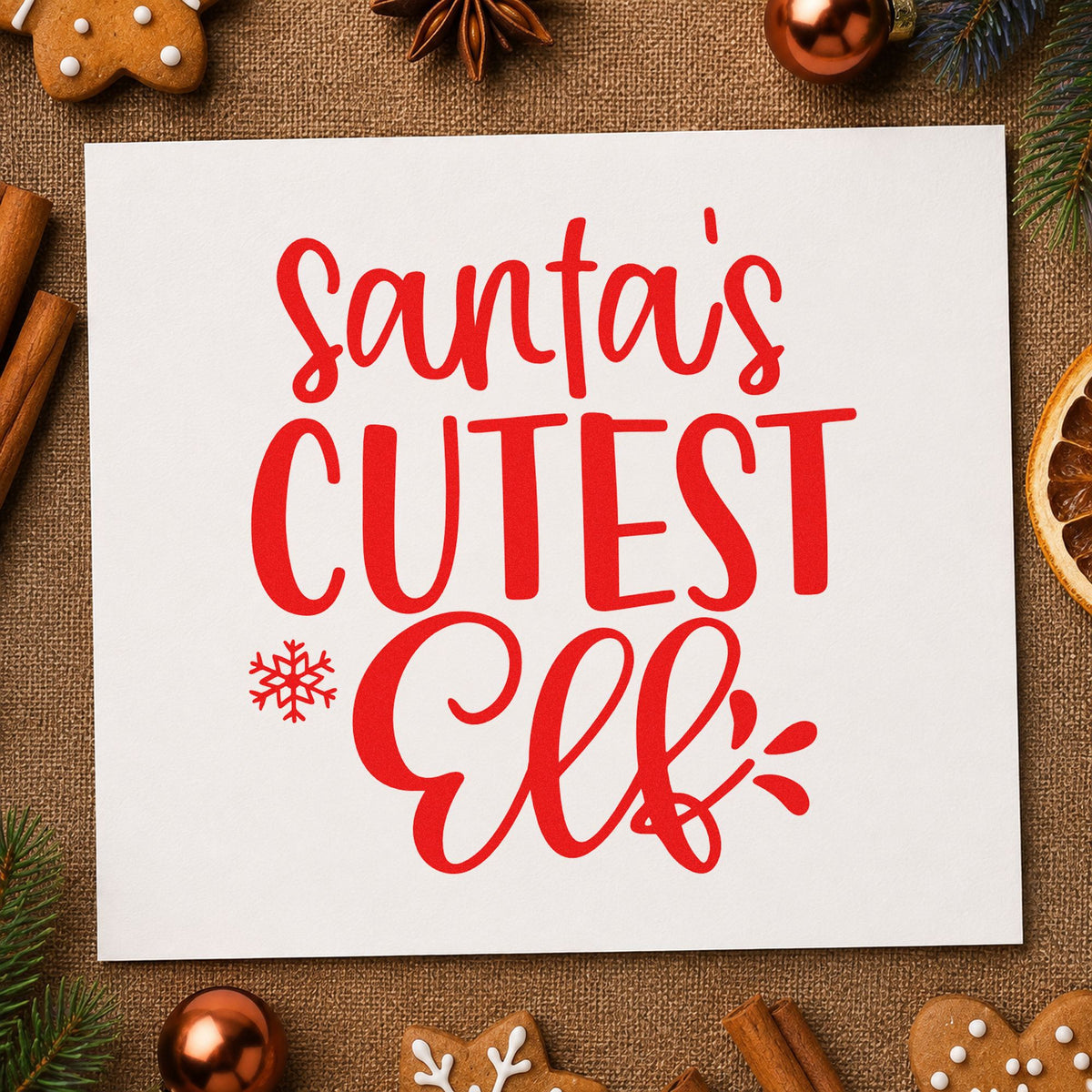 Santa's Cutest Elf Lettering rubber stamp shown in red ink, stamped for projects such as daycare party favors.