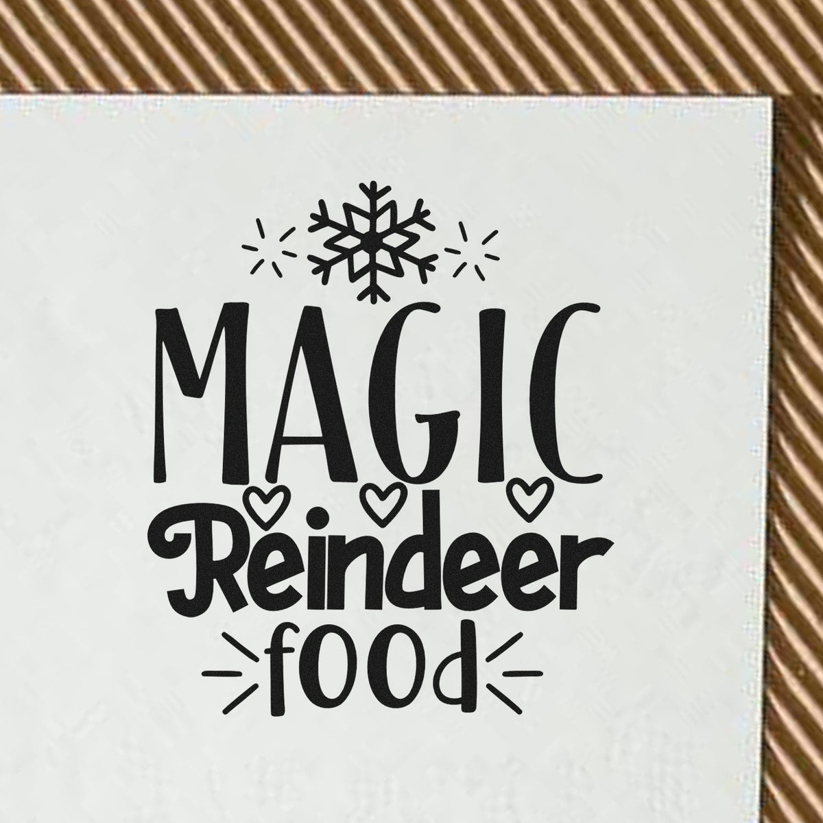 Black Magic Reindeer Food stamp and seal with snowflake and hearts on a white card.