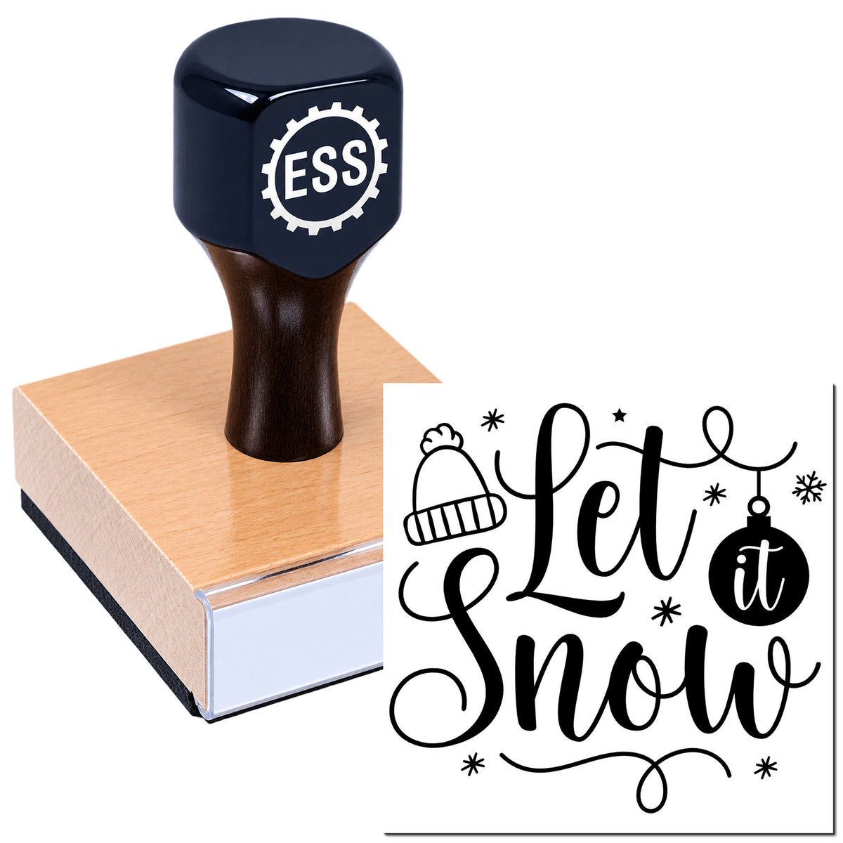 Black ESS seal stamp on wooden block with "let it snow" holiday script, beanie, ornament and snowflake accents.
