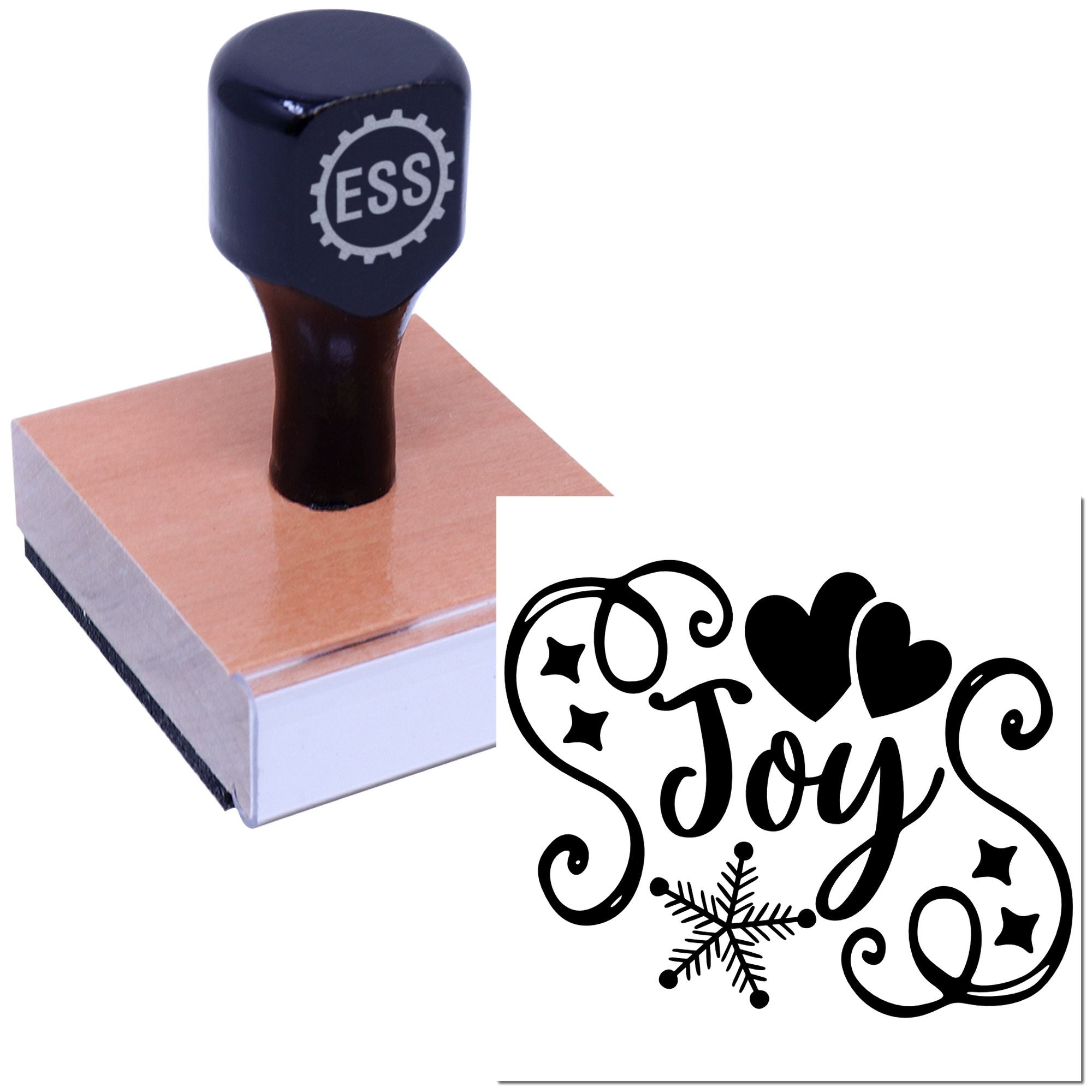 Navy custom stamp on a wooden block beside a black decorative seal reading Joy with hearts and a snowflake.