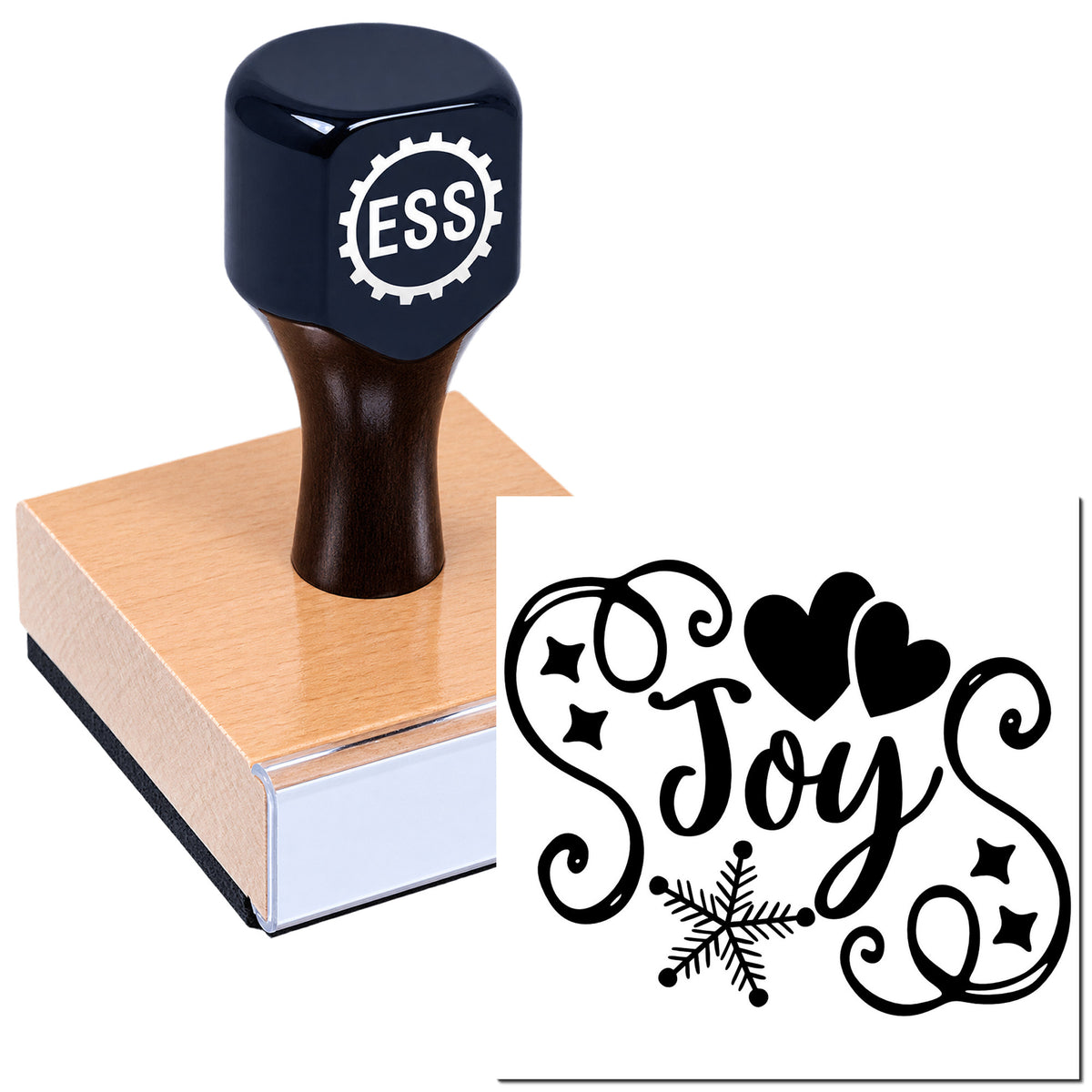 Navy custom stamp on a wooden block beside a black decorative seal reading "Joy" with hearts and a snowflake.