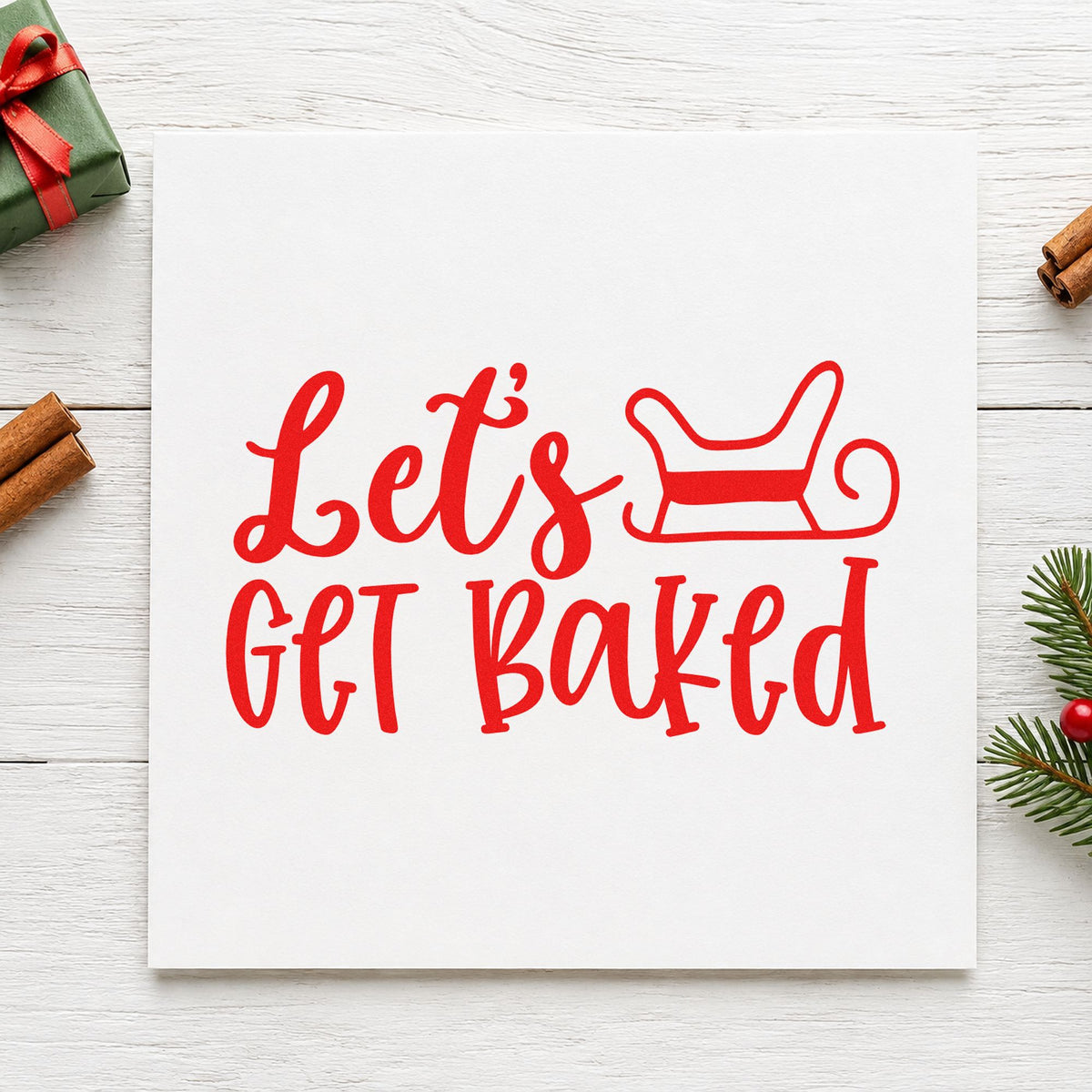 Let's Get Baked Sleigh craft stamp in red ink on cardstock, an easy option for cooler cloth printing.