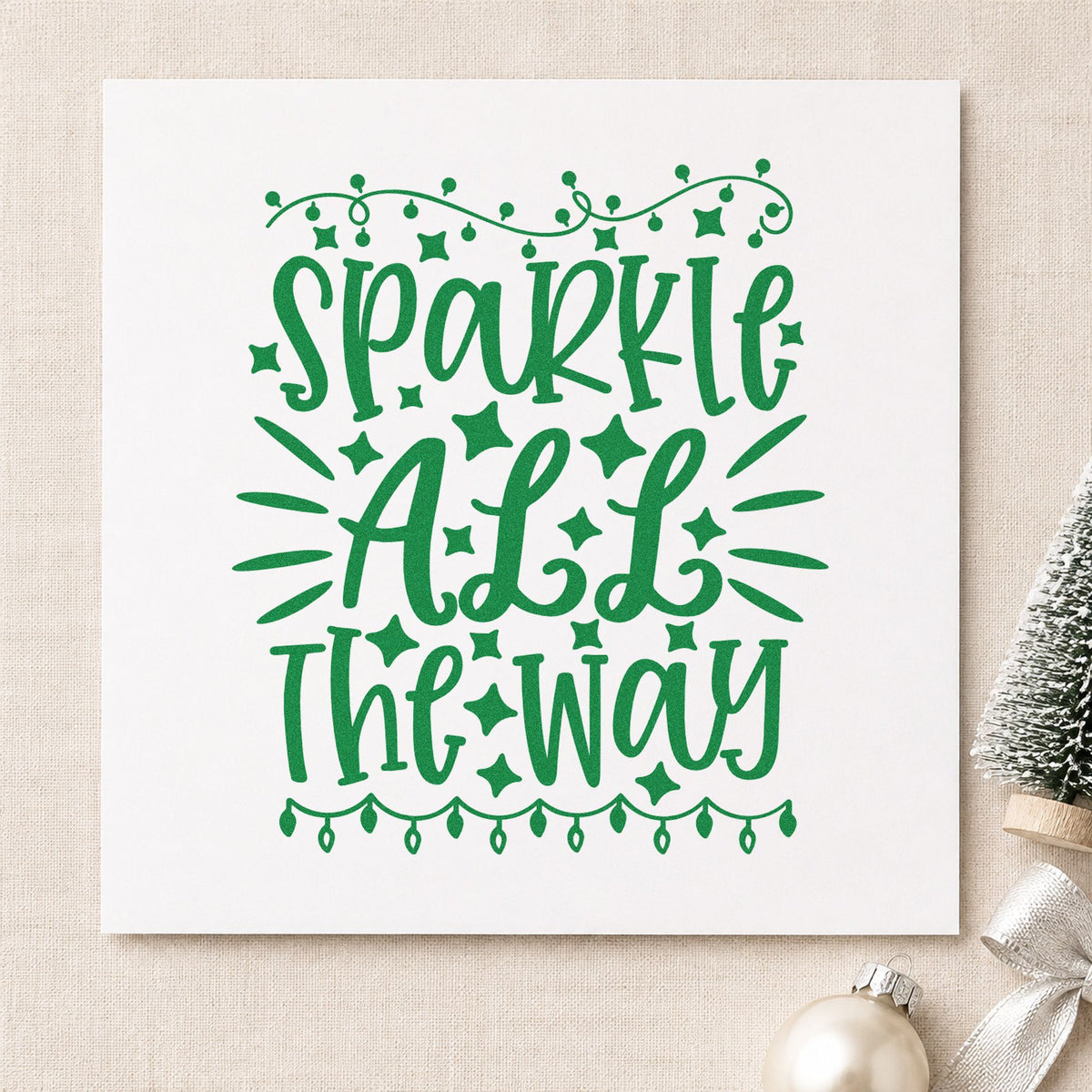 Sparkle All The Way Lights craft stamp imprint in green ink on a handmade project, one idea being strand set gift tags.