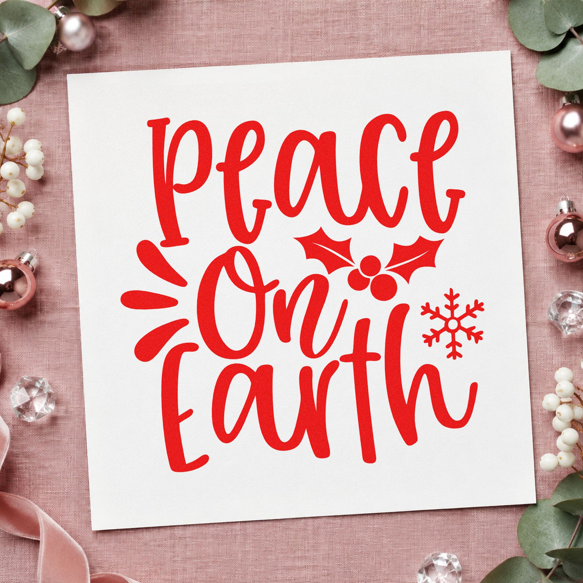 Peace On Earth Holly craft stamp in red ink on cardstock, an easy option for napkin hem printing.